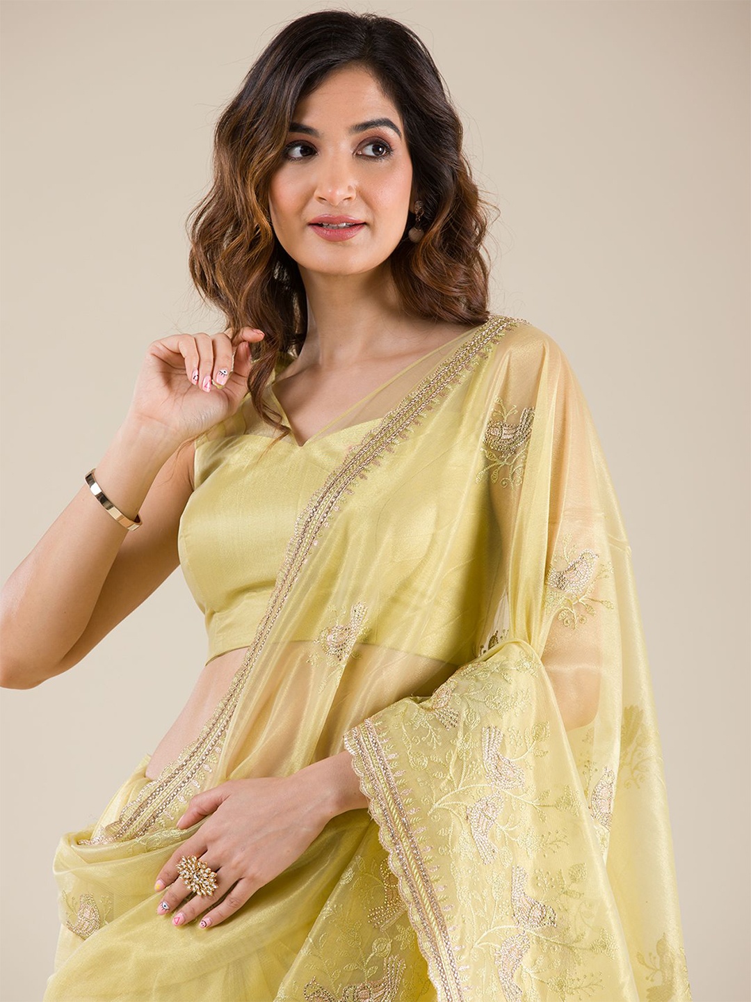 

Koskii Ethnic Motifs Embroidered Tissue Saree, Yellow