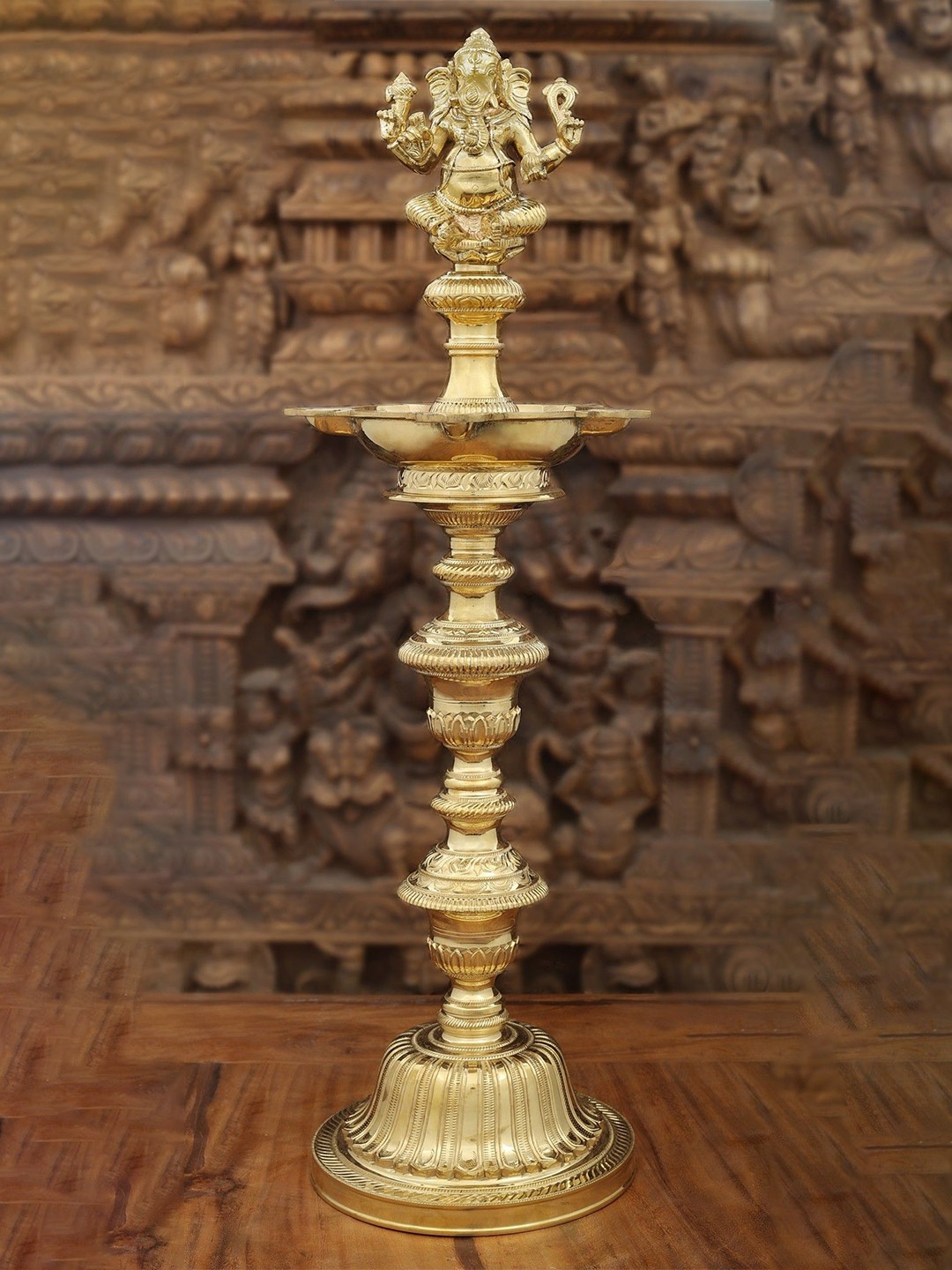 

Exotic India Gold-Toned Textured Brass Superfine Ganesha Multiwicks Lamp