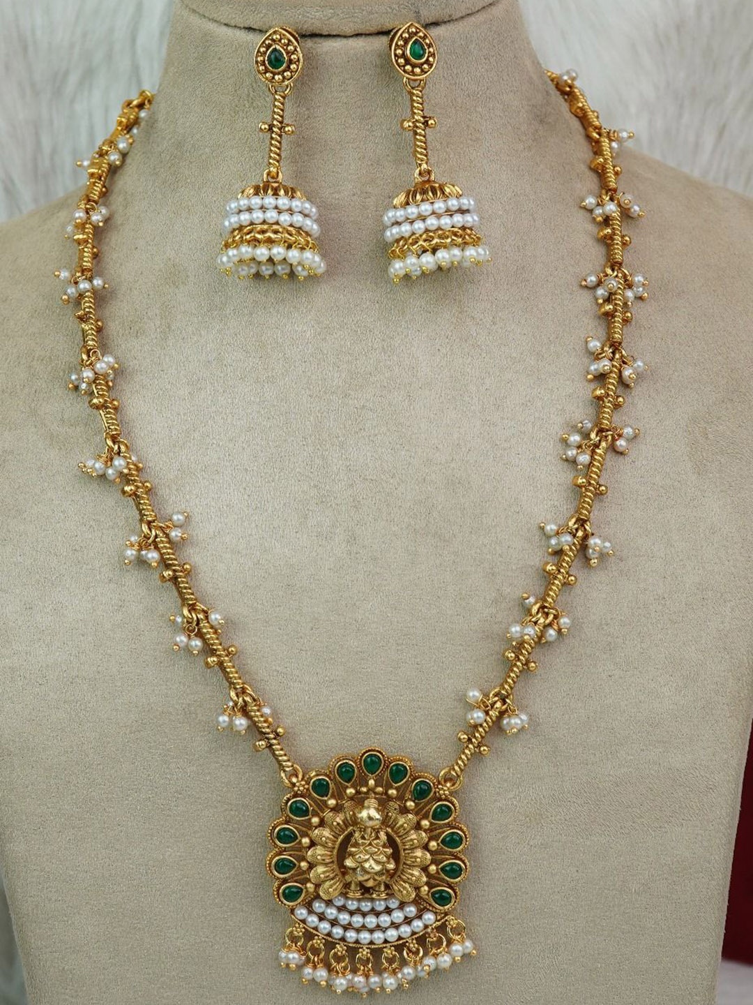 

Diksha collection Gold Plated Stone and Beads Studded Temple Jewellery Set