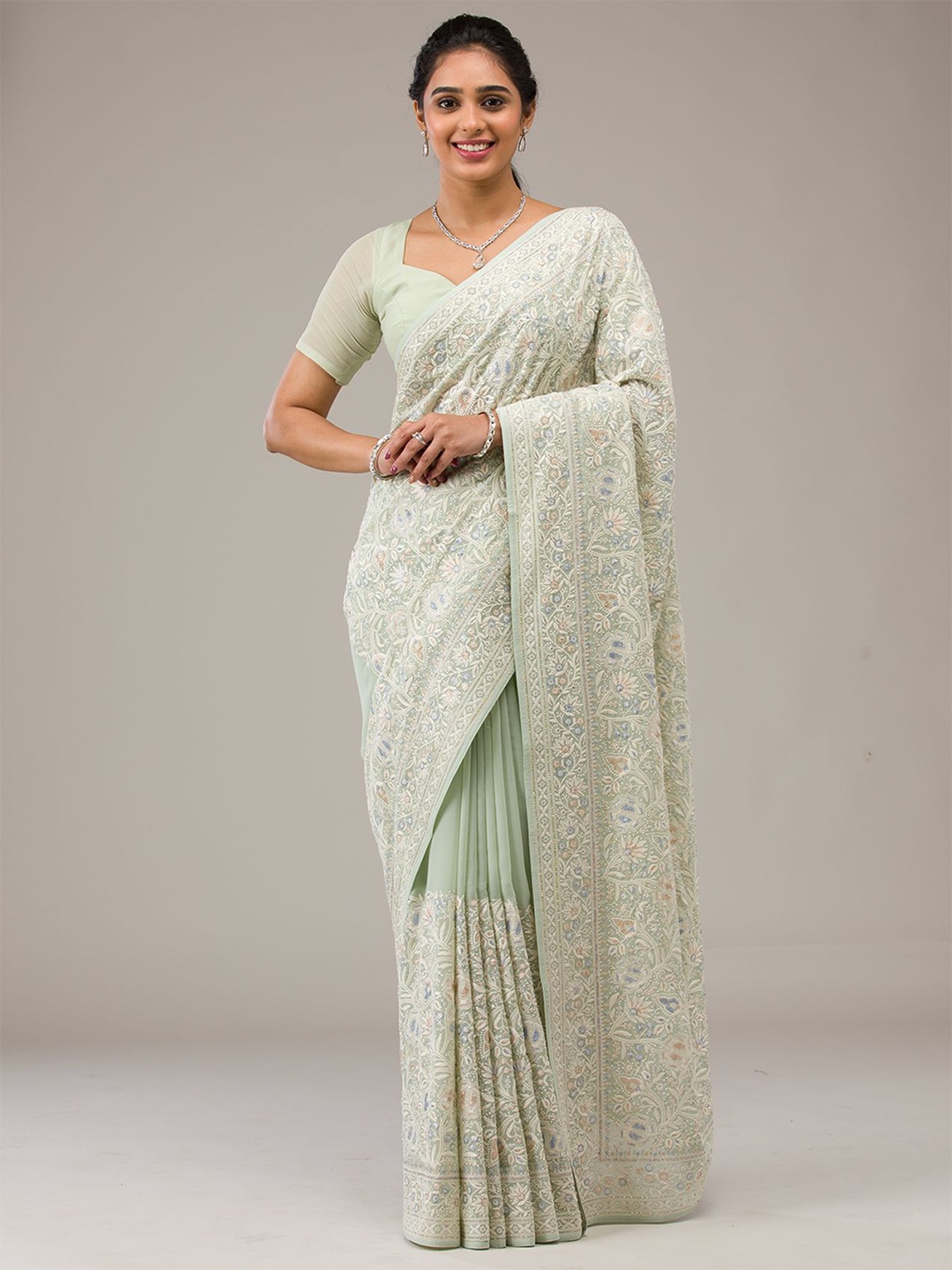 

Koskii Ethnic Motif Embroidered Pure Georgette Saree, Green