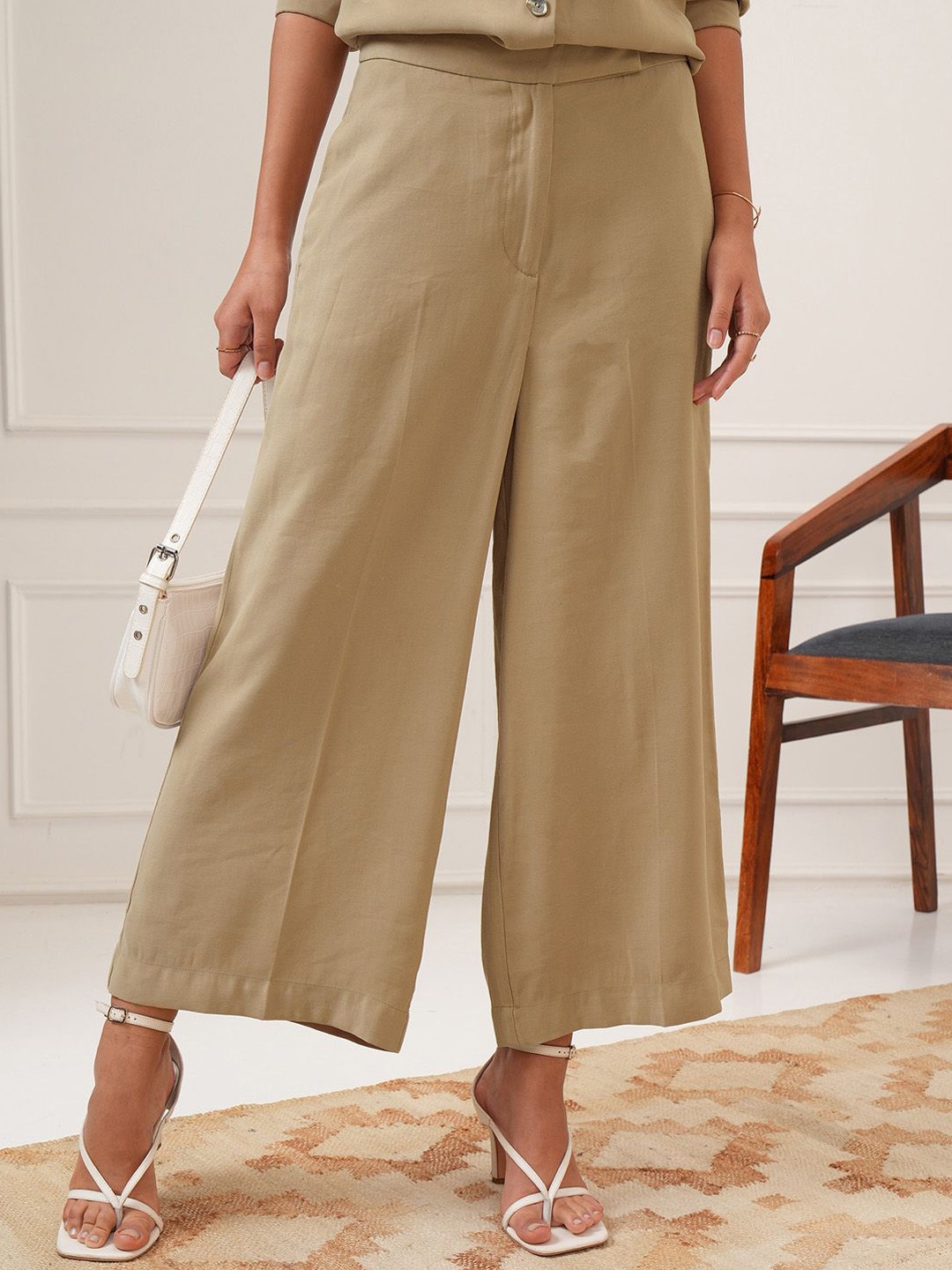 

Tokyo Talkies Women Solid Flared Trousers, Beige