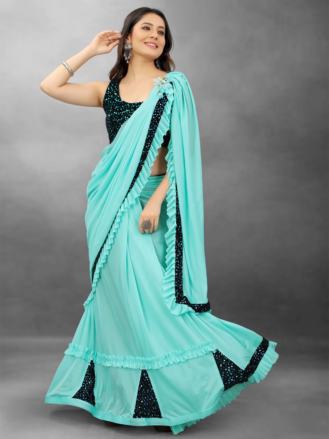 

Aika Emblished Saree With Ruffels Border, Turquoise blue