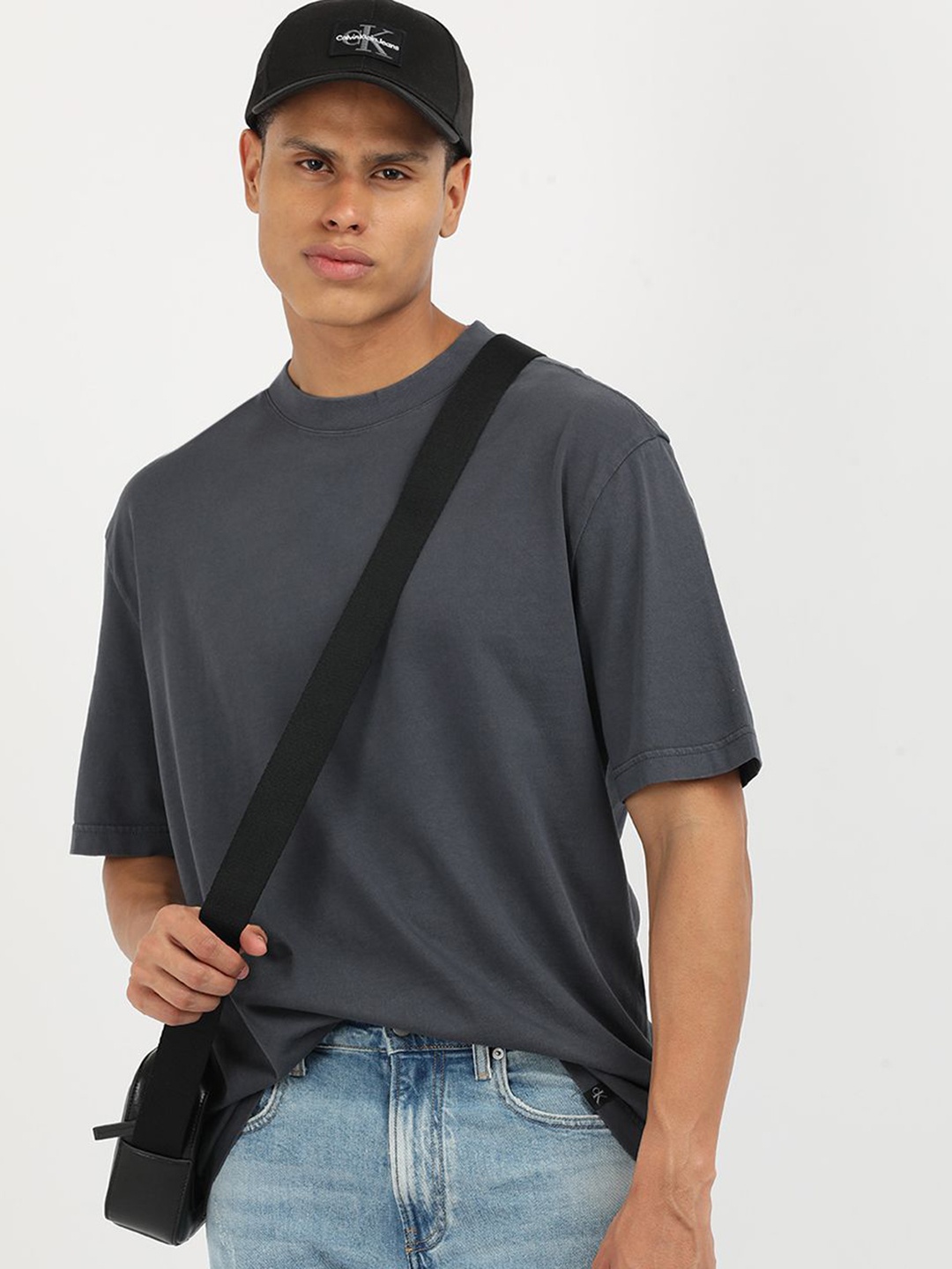 

Calvin Klein Jeans Men Solid Round Neck Cotton Relaxed Fit T-Shirt, Grey