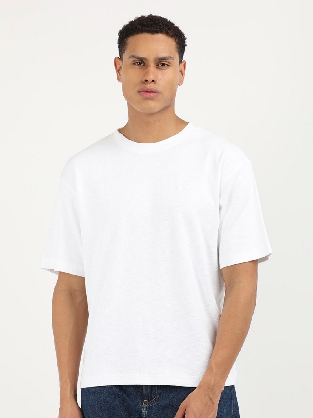 

Calvin Klein Jeans Men Solid Round Neck Cotton Relaxed Fit T-Shirt, White