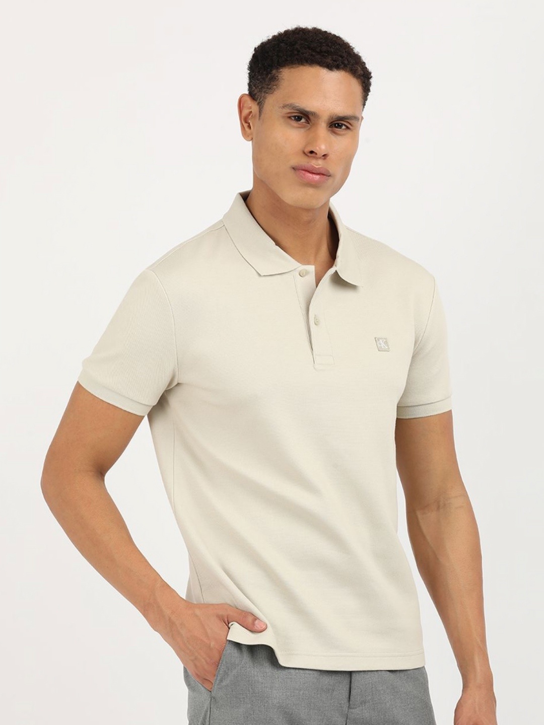 

Calvin Klein Jeans Men Solid Polo Collar Cotton T-Shirt, Beige