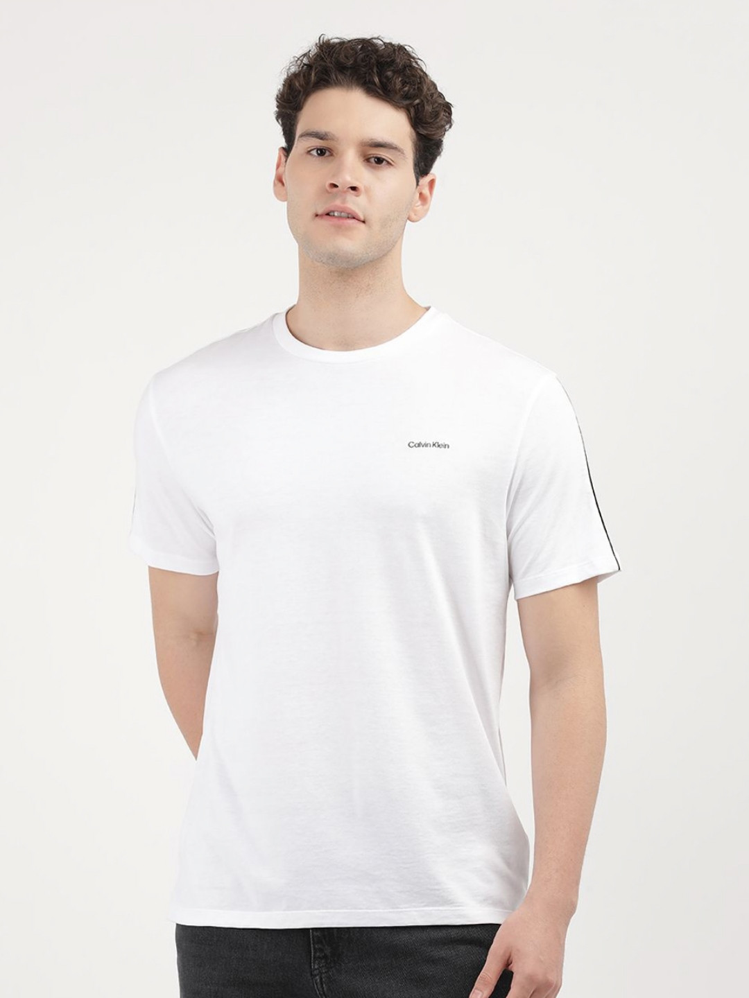 

Calvin Klein Jeans Men Solid Round Neck Cotton T-Shirt, White