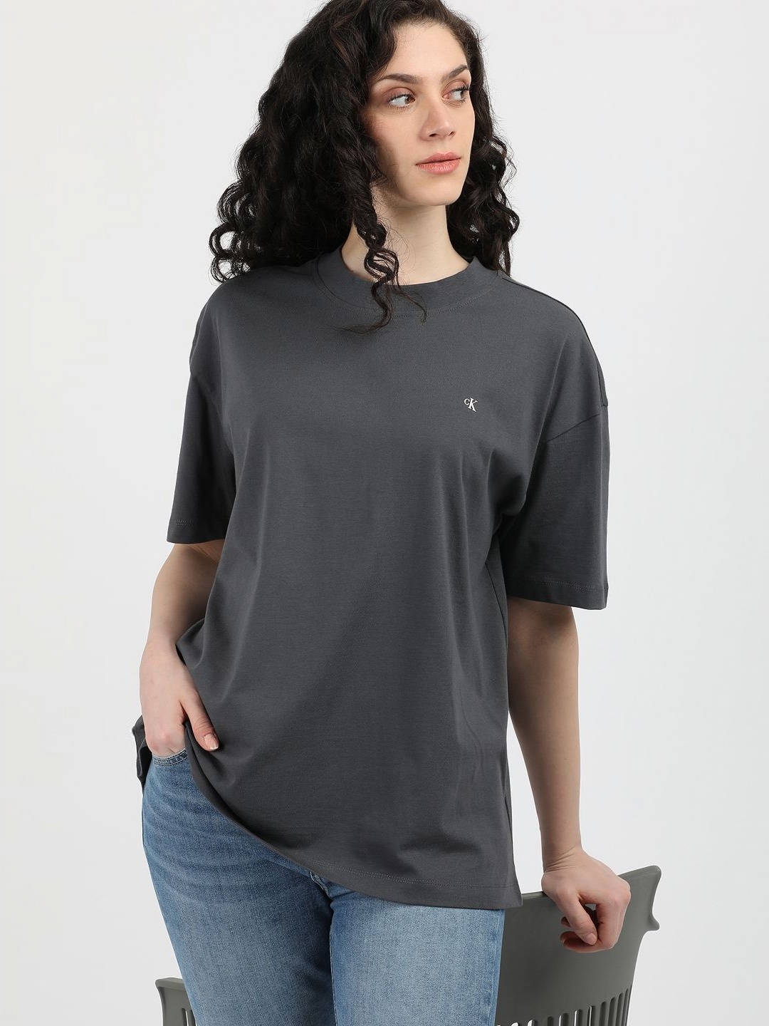 

Calvin Klein Jeans Women Solid Round Neck Cotton Oversized T-Shirt, Grey