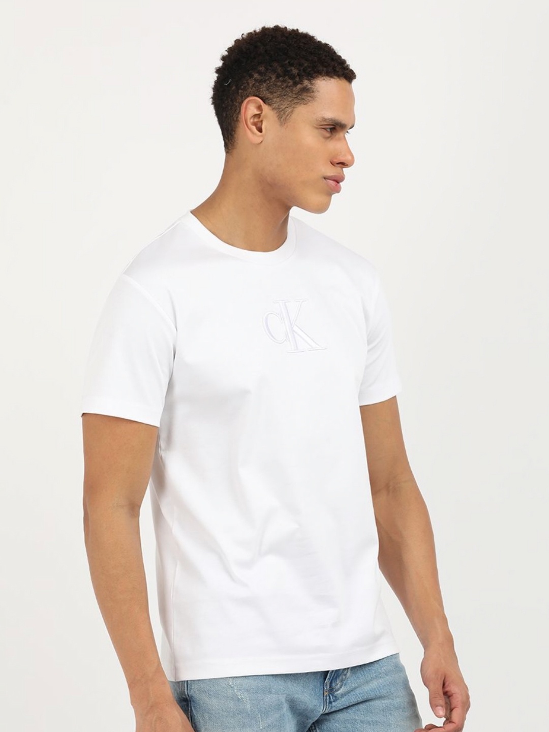 

Calvin Klein Jeans Men Solid Round Neck Cotton T-Shirt, White