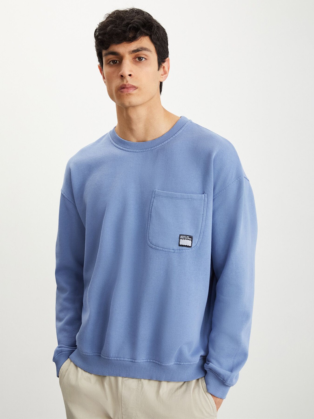 

GRIMELANGE Men Solid Round Neck Sweatshirt, Blue