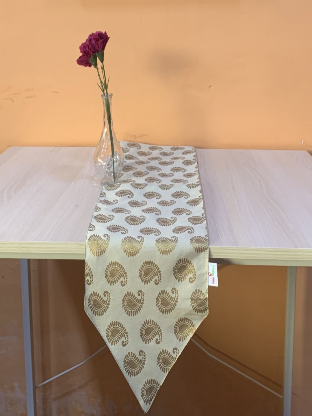 

Pink Parrot Cream-Colored & Gold toned Paisely Printed Table Runner