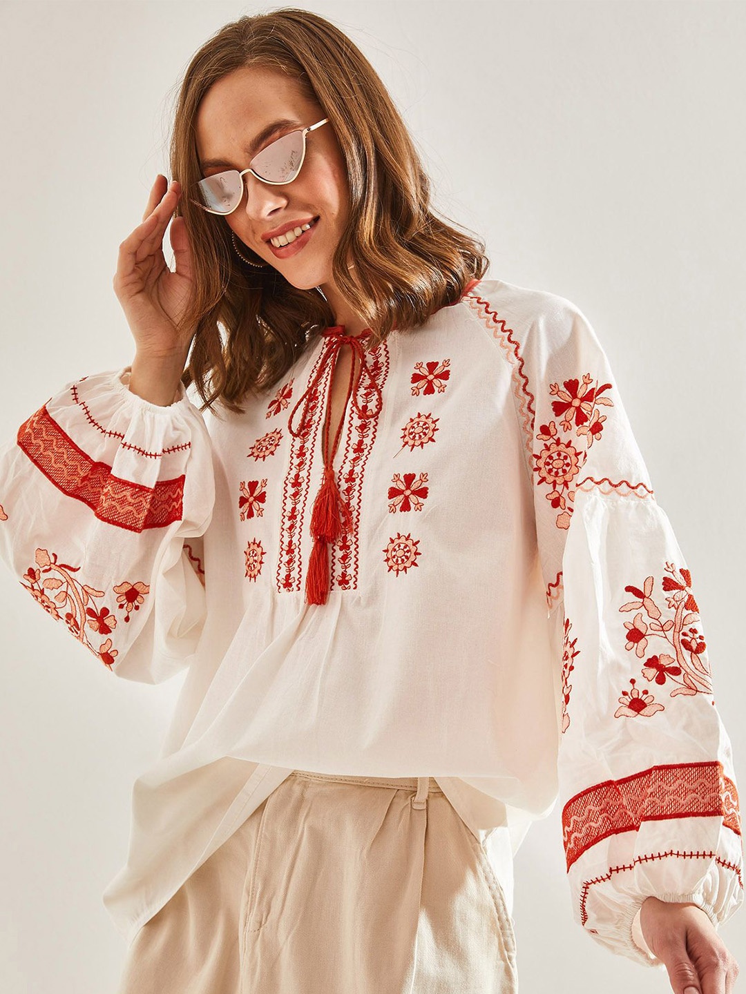 

BIANCO LUCCI Floral Embellished Tie-Up Neck Flared Sleeve Top, Na