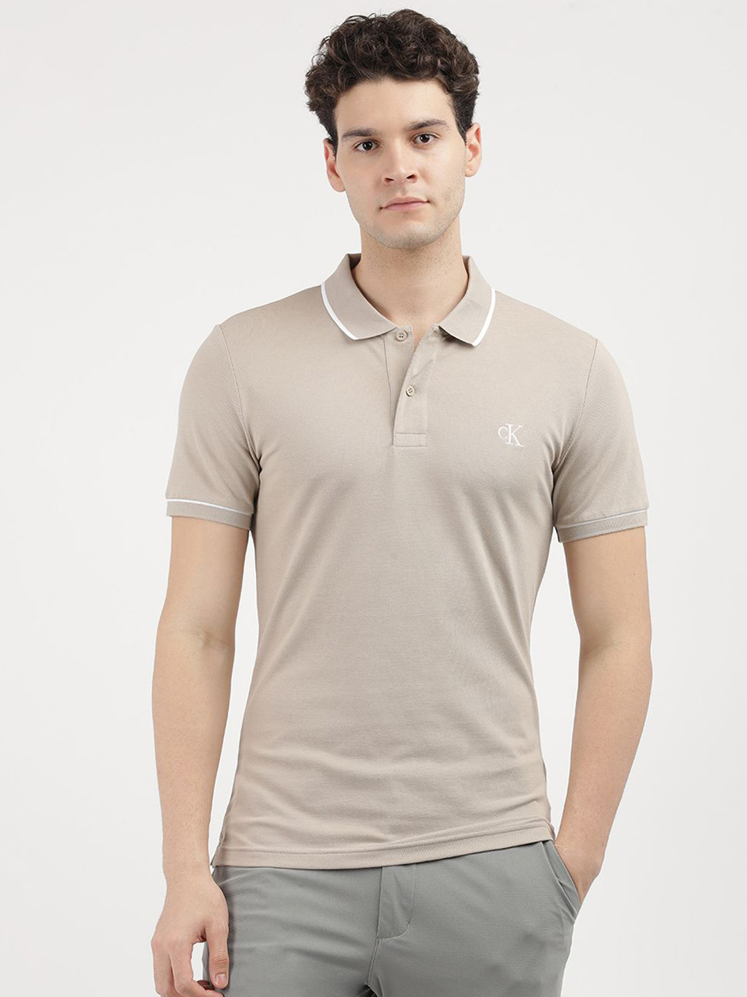 

Calvin Klein Jeans Men Solid Polo Collar Cotton Slim Fit T-Shirt, Pink