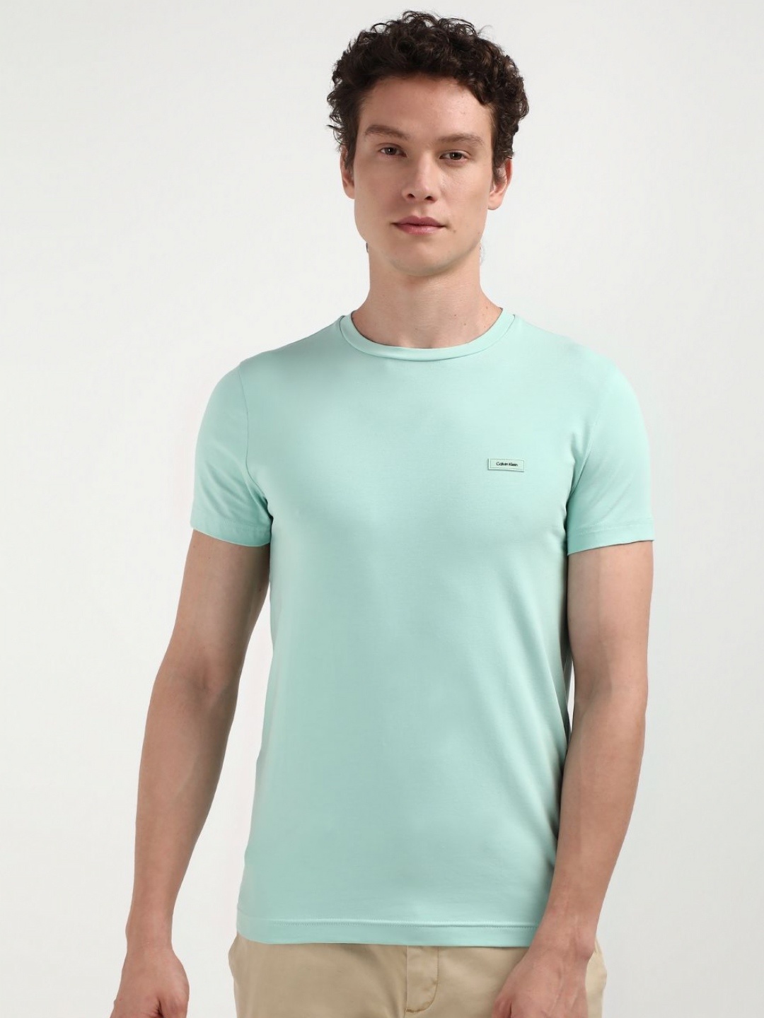 

Calvin Klein Jeans Men Solid Round Neck Cotton Slim Fit T-Shirt, Green