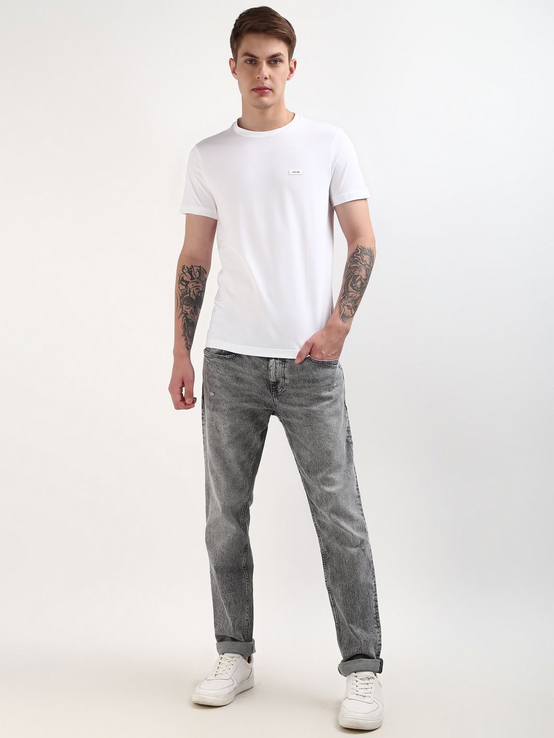 

Calvin Klein Jeans Men Solid Round Neck Cotton Slim Fit T-Shirt, White