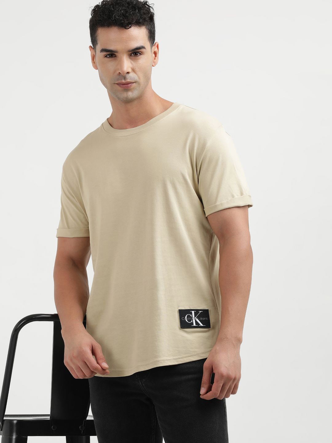 

Calvin Klein Jeans Men Solid Round Neck Applique T-shirt, Beige