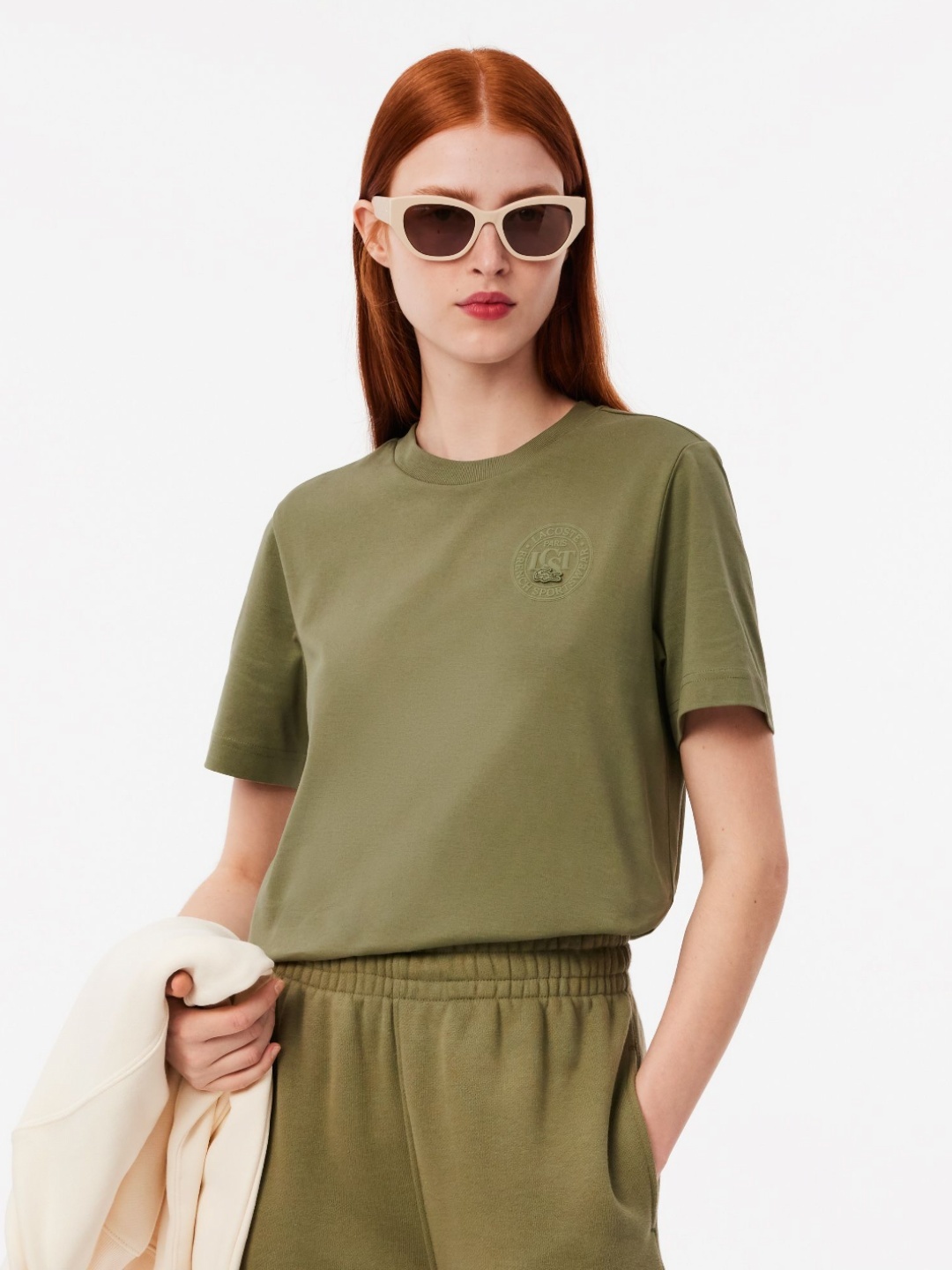 

Lacoste Women Solid Round Neck Cotton T-Shirt, Brown