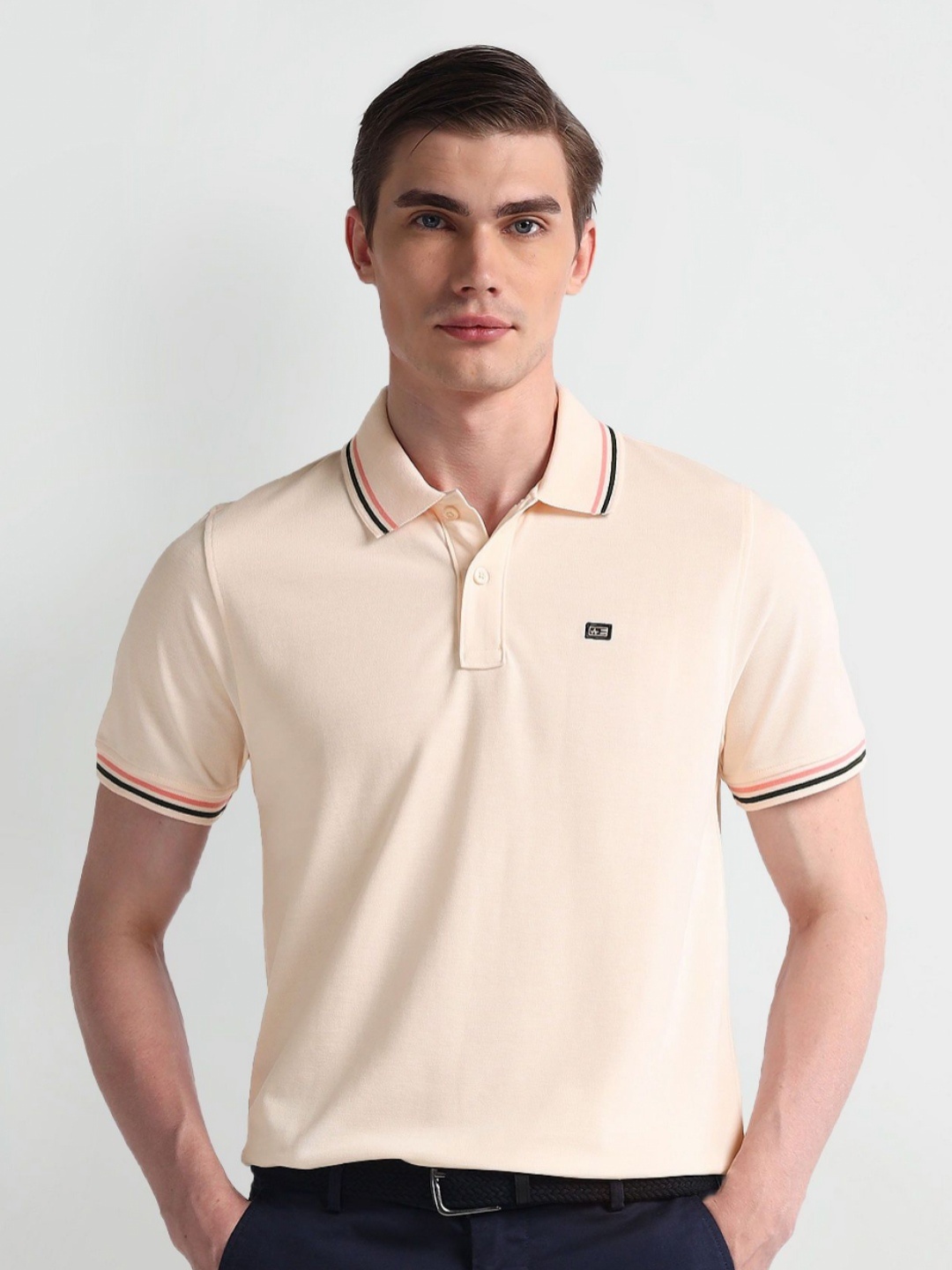

Arrow Sport Men Solid Polo Collar Cotton T-Shirt, Pink