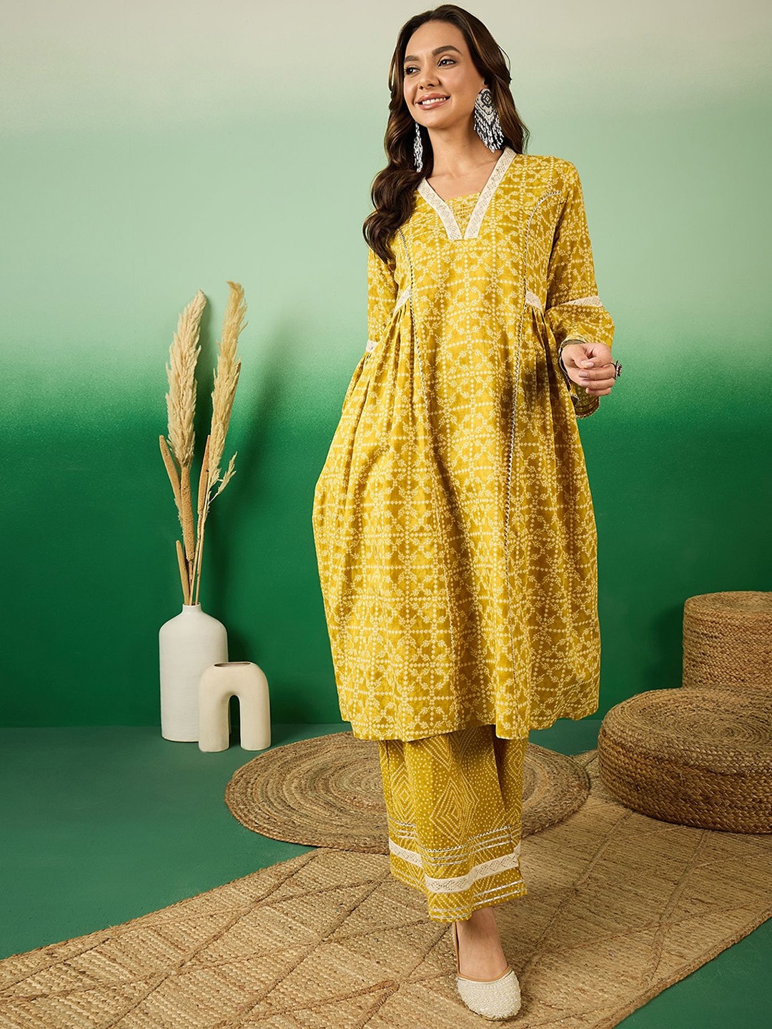 

Sangria Yellow Bandhani Printed Pure Cotton Panelled A-Line Kurta With Palazzos