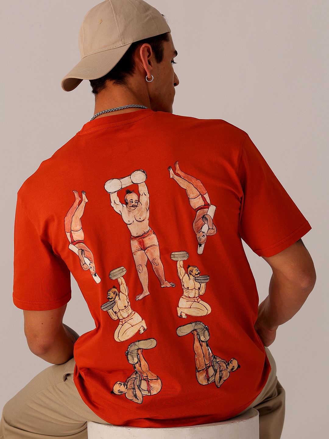 

The Indian Garage Co Men Back Printed Boxy Oversized Round Neck T-shirt, Orange