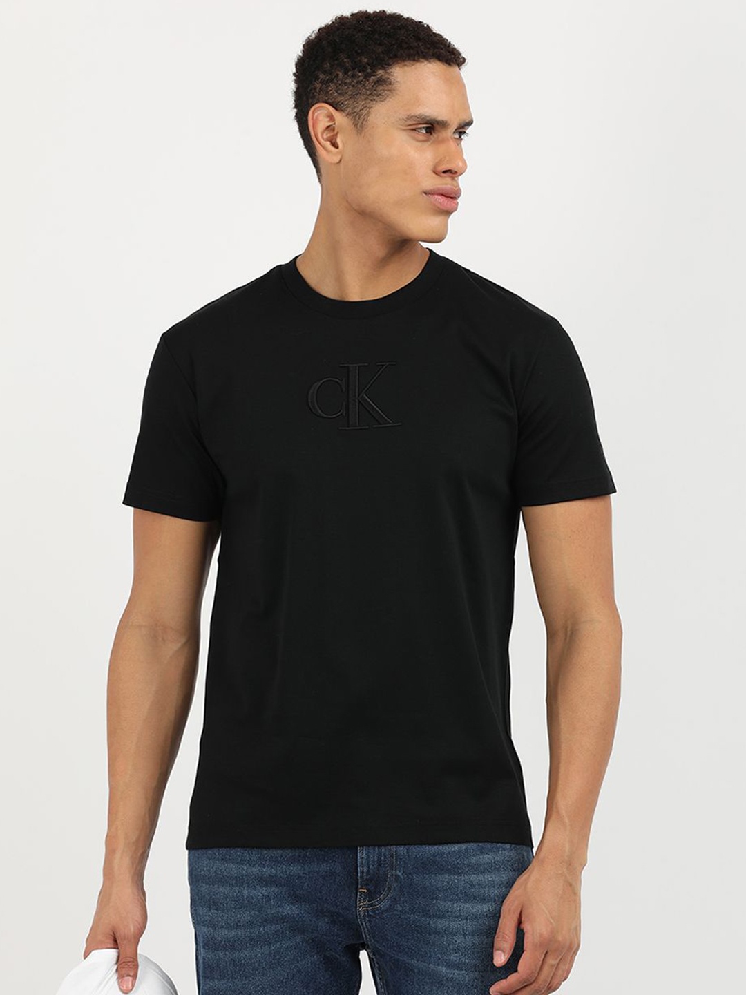 

Calvin Klein Jeans Men Solid Round Neck Cotton T-Shirt, Black