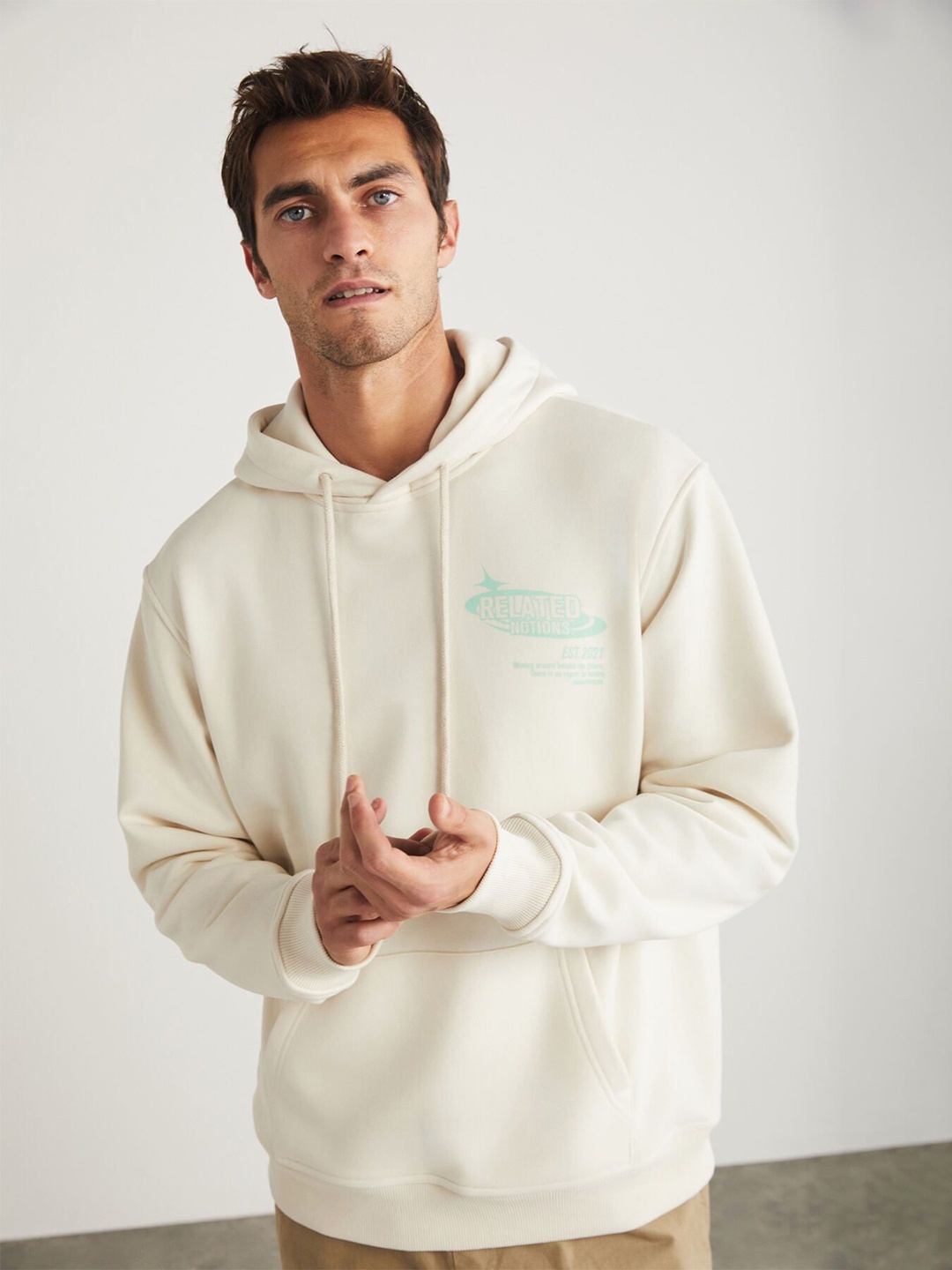 

GRIMELANGE Men Typography Printed Hooded Sweatshirt, Cream
