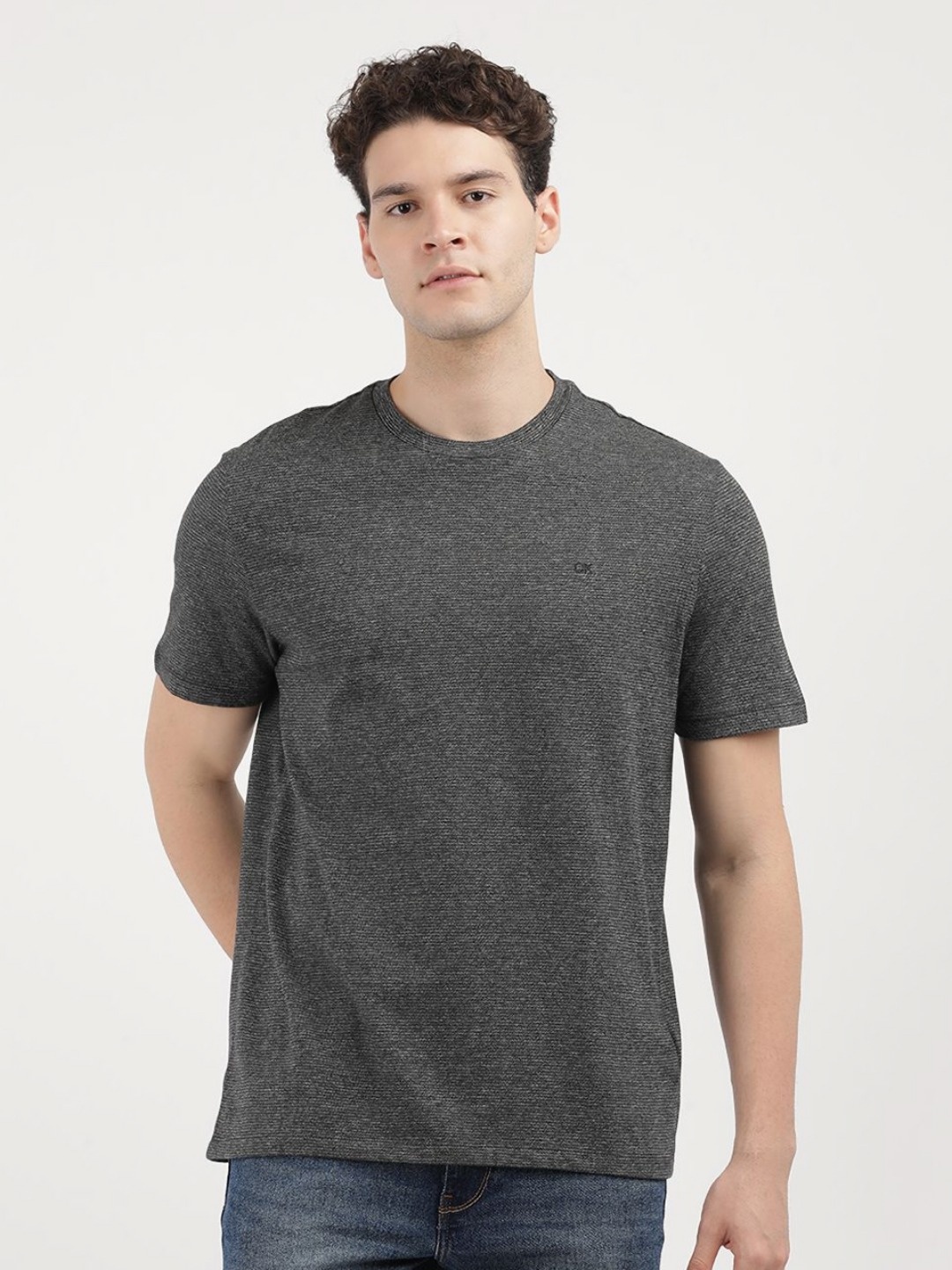 

Calvin Klein Jeans Men Solid Round Neck Cotton T-Shirt, Black