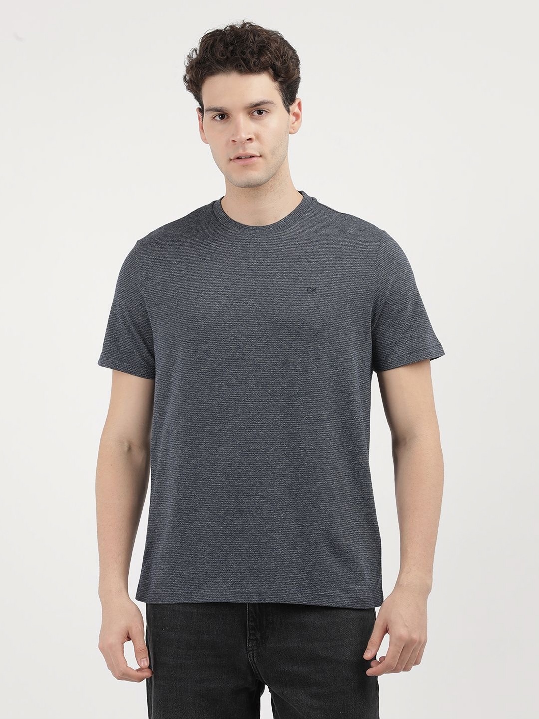 

Calvin Klein Jeans Men Solid Round Neck Cotton T-Shirt, Blue
