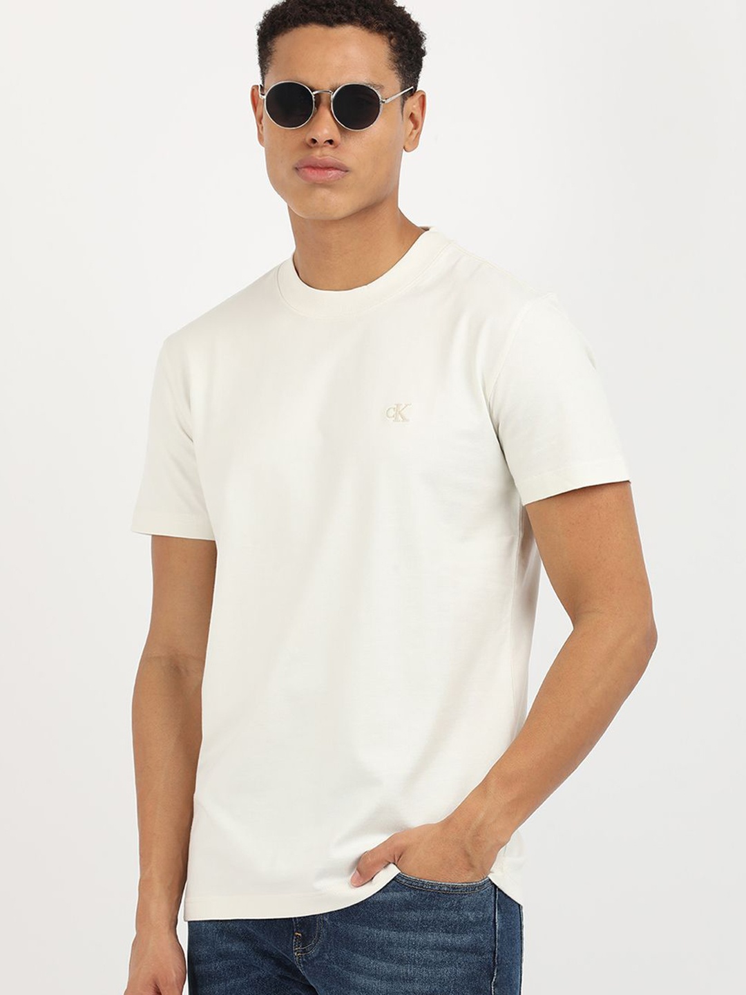 

Calvin Klein Jeans Men Solid Round Neck Cotton T-Shirt, Beige