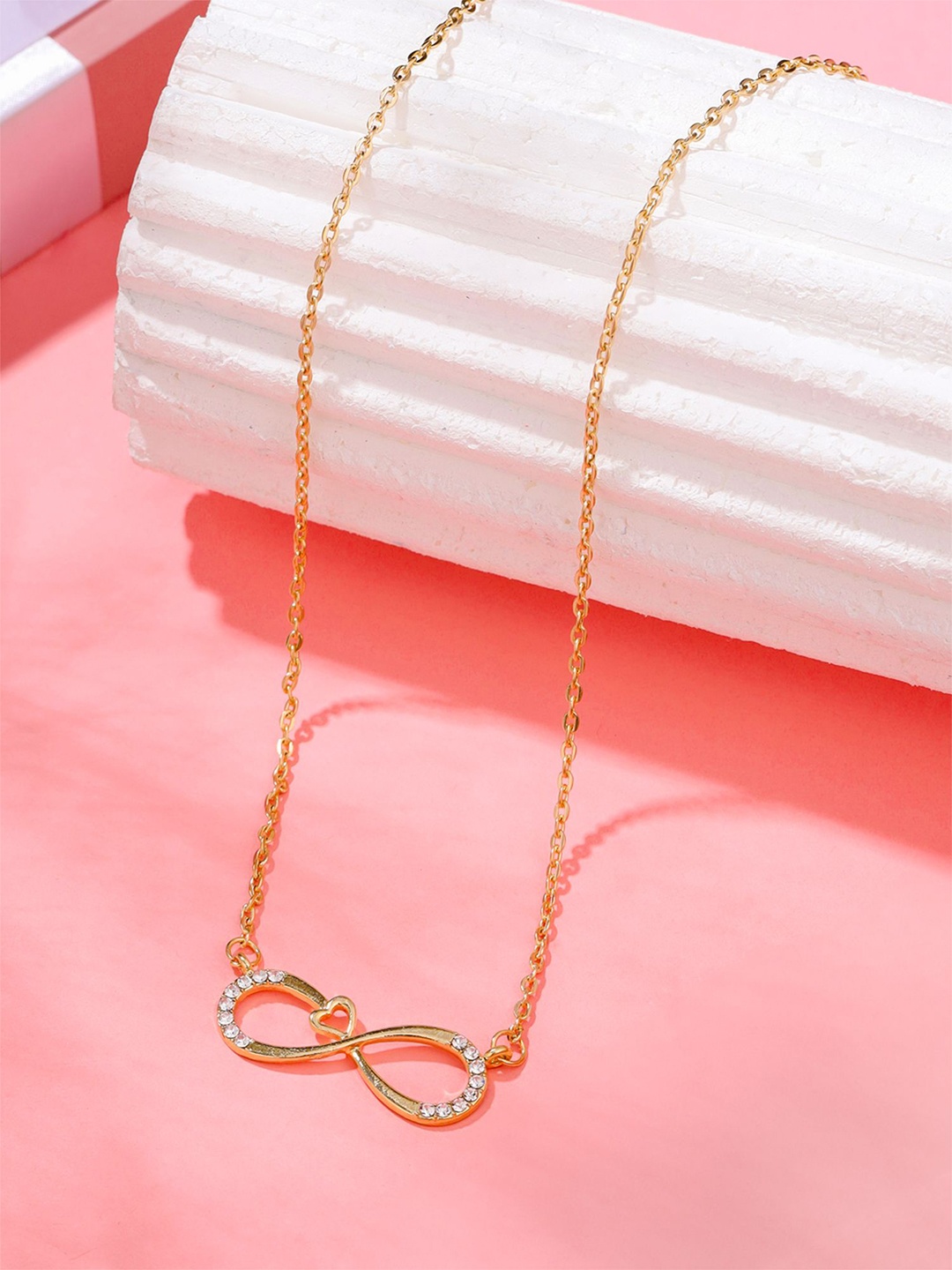

Yellow Chimes Girls Gold Plated Stones Studded Infinity Heart Shaped Necklace