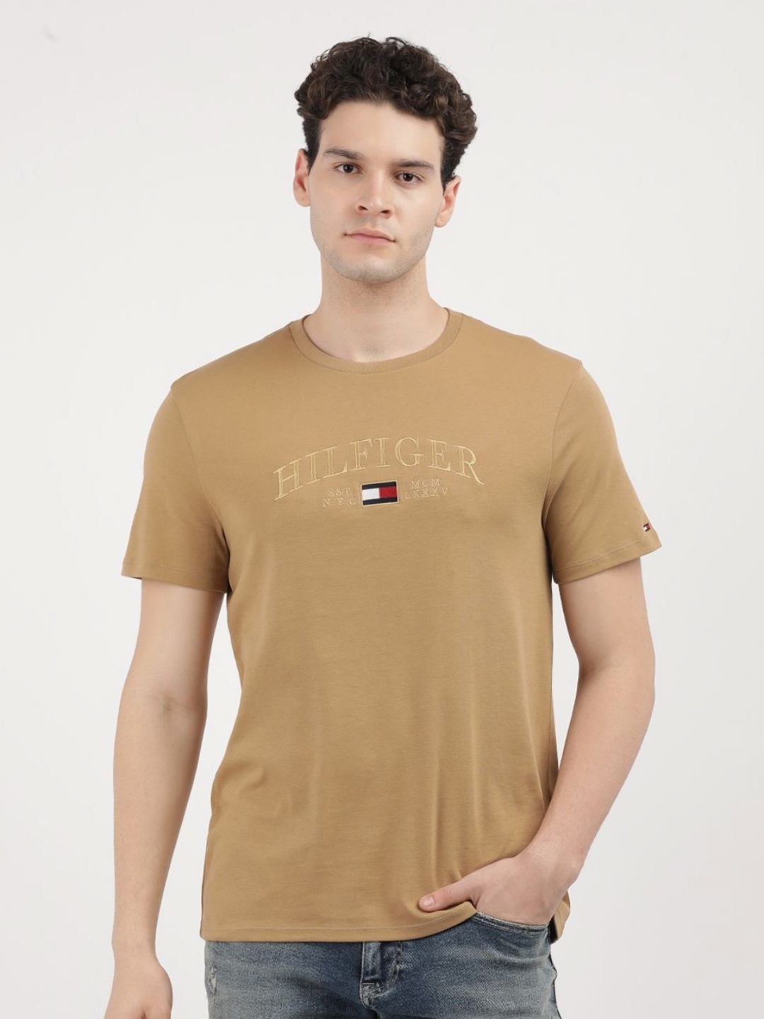 

Tommy Hilfiger Men Solid Round Neck Cotton T-Shirt, Beige