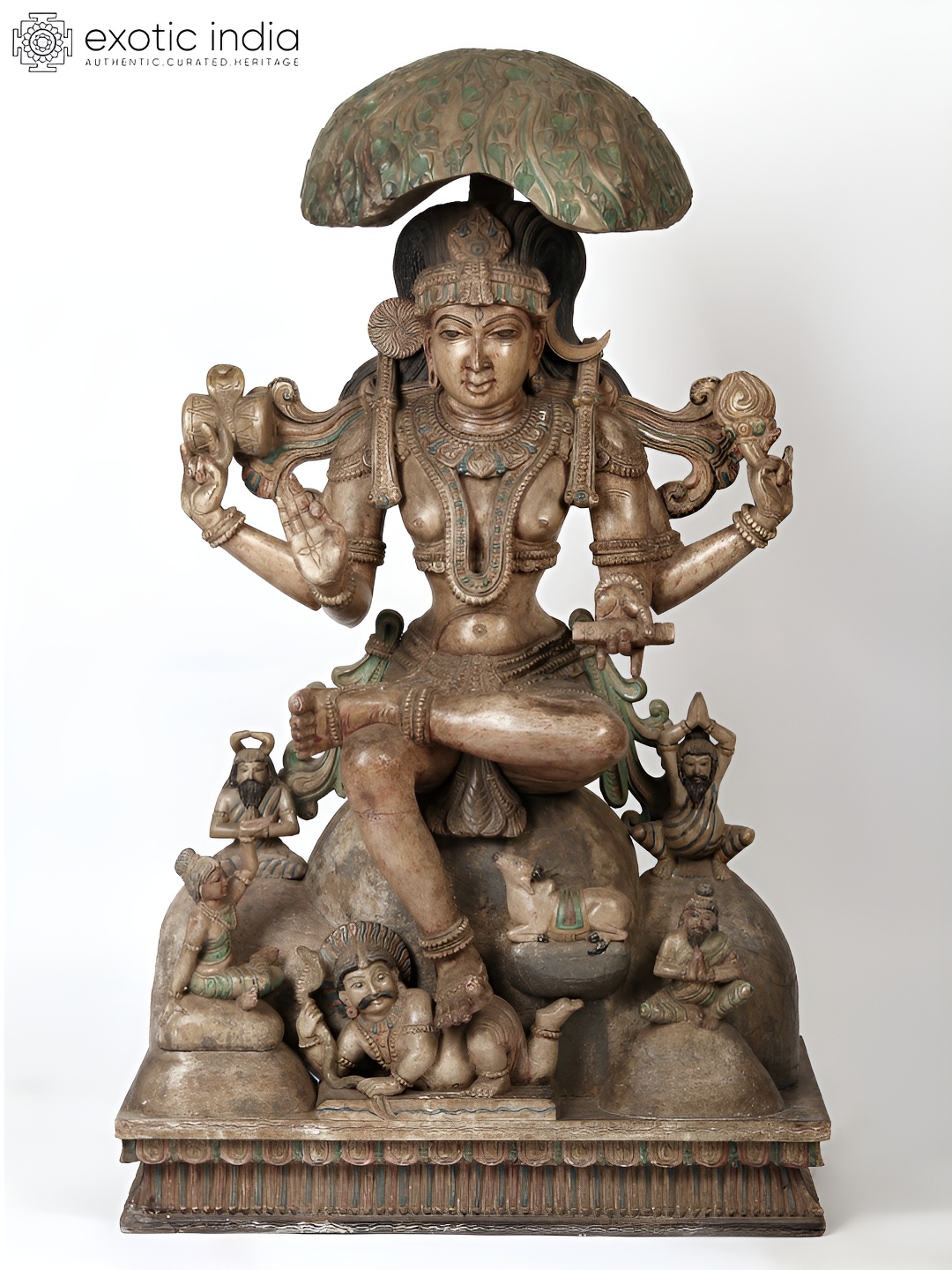 

Exotic India Brown Religious Dakshinamurti Religious Wooden Idol Showpiece