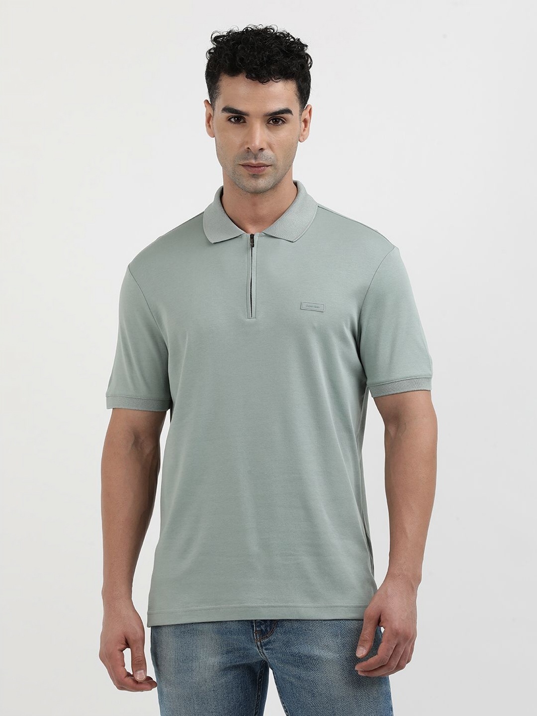 

Calvin Klein Jeans Men Solid Polo Collar Organic Cotton T-Shirt, Grey