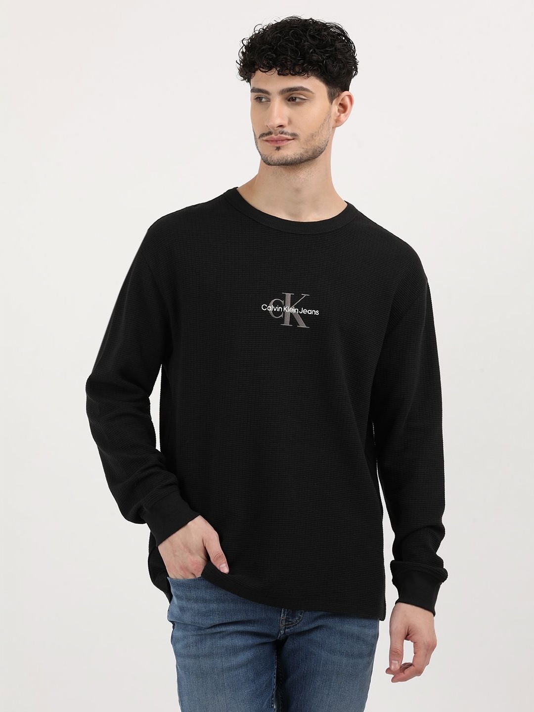 

Calvin Klein Jeans Men Solid Round Neck Cotton Relaxed Fit T-Shirt, Black