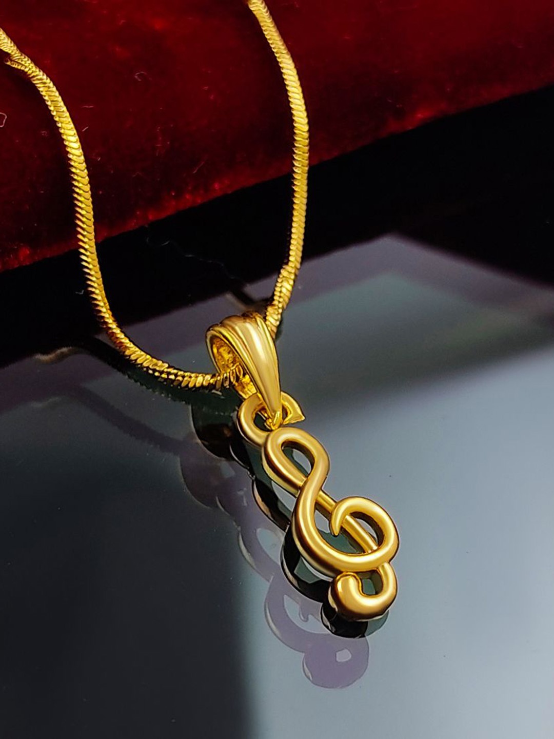 

Saizen Gold-Plated Stone Studded Contemporary Clef-Shaped Pendants With Chain