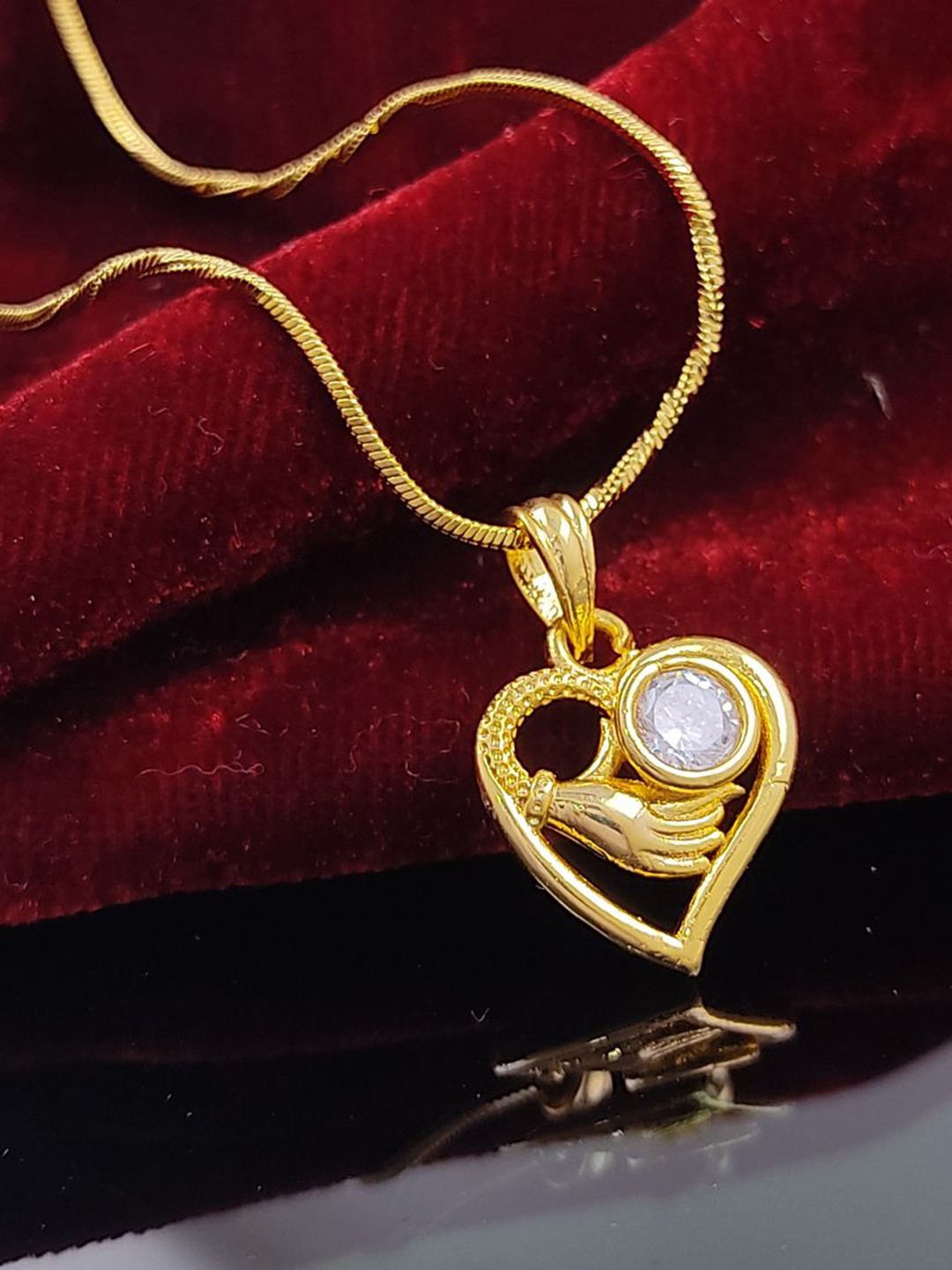 

Saizen Gold-Plated Stone Studded Heart Shaped Pendant With Chain