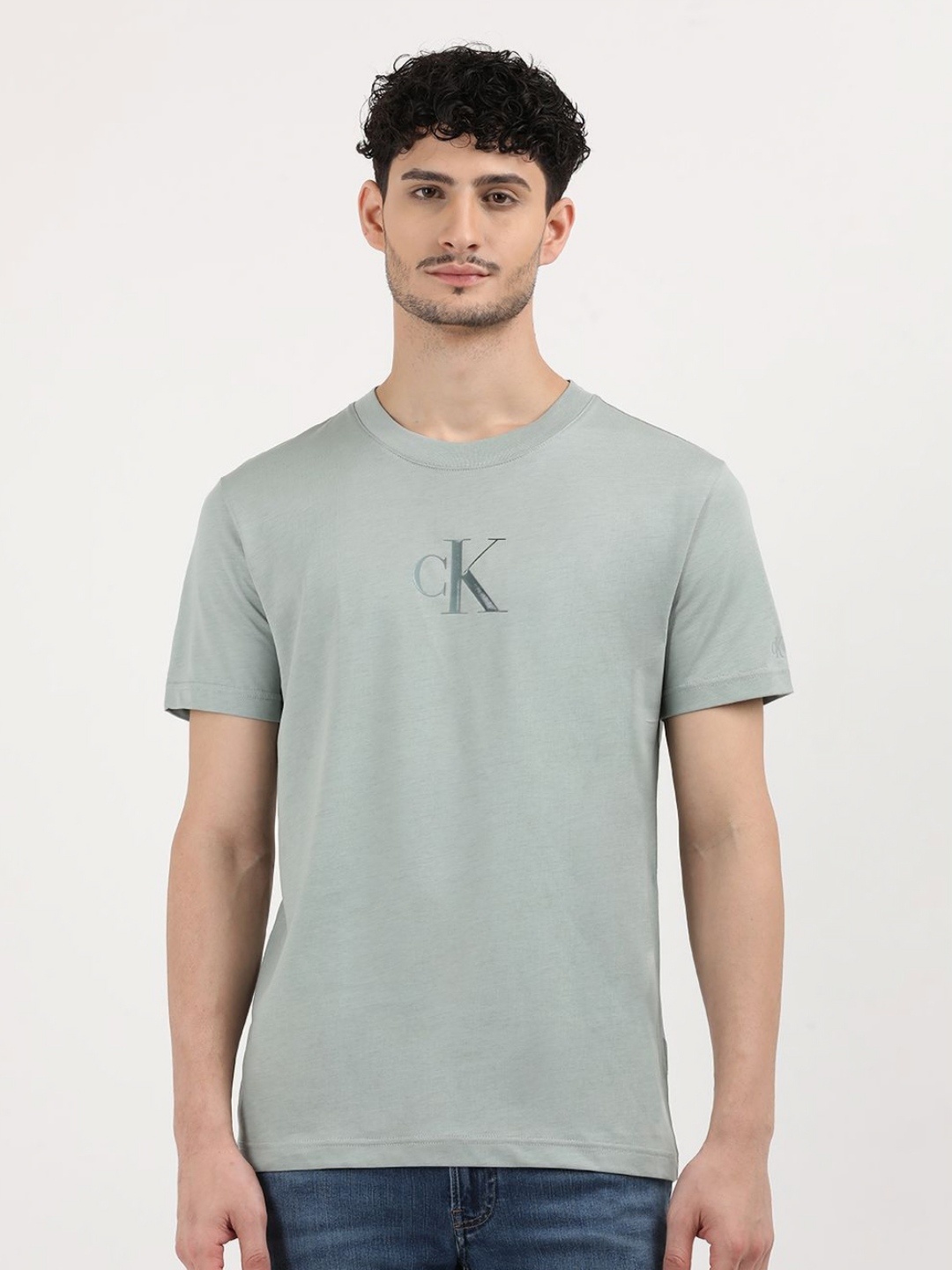 

Calvin Klein Jeans Men Typography Printed Round Neck Cotton T-Shirt, Teal