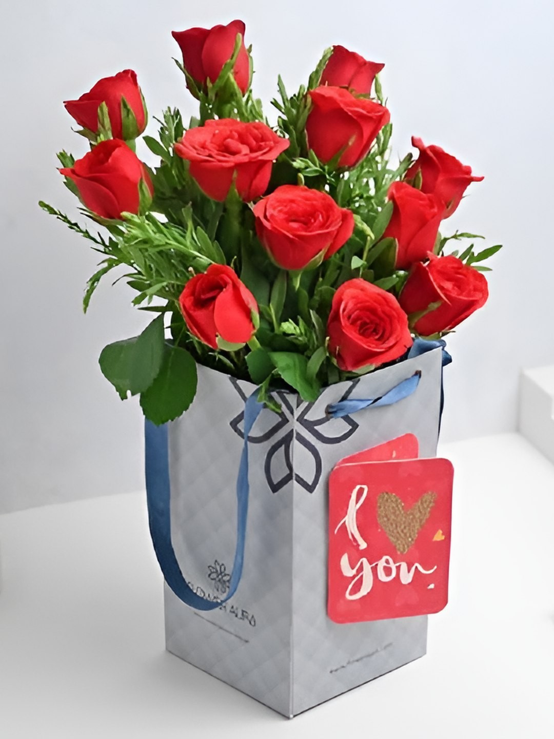 

Floweraura Love Theme Red & Green 12 Pieces Fresh Roses Bouquet