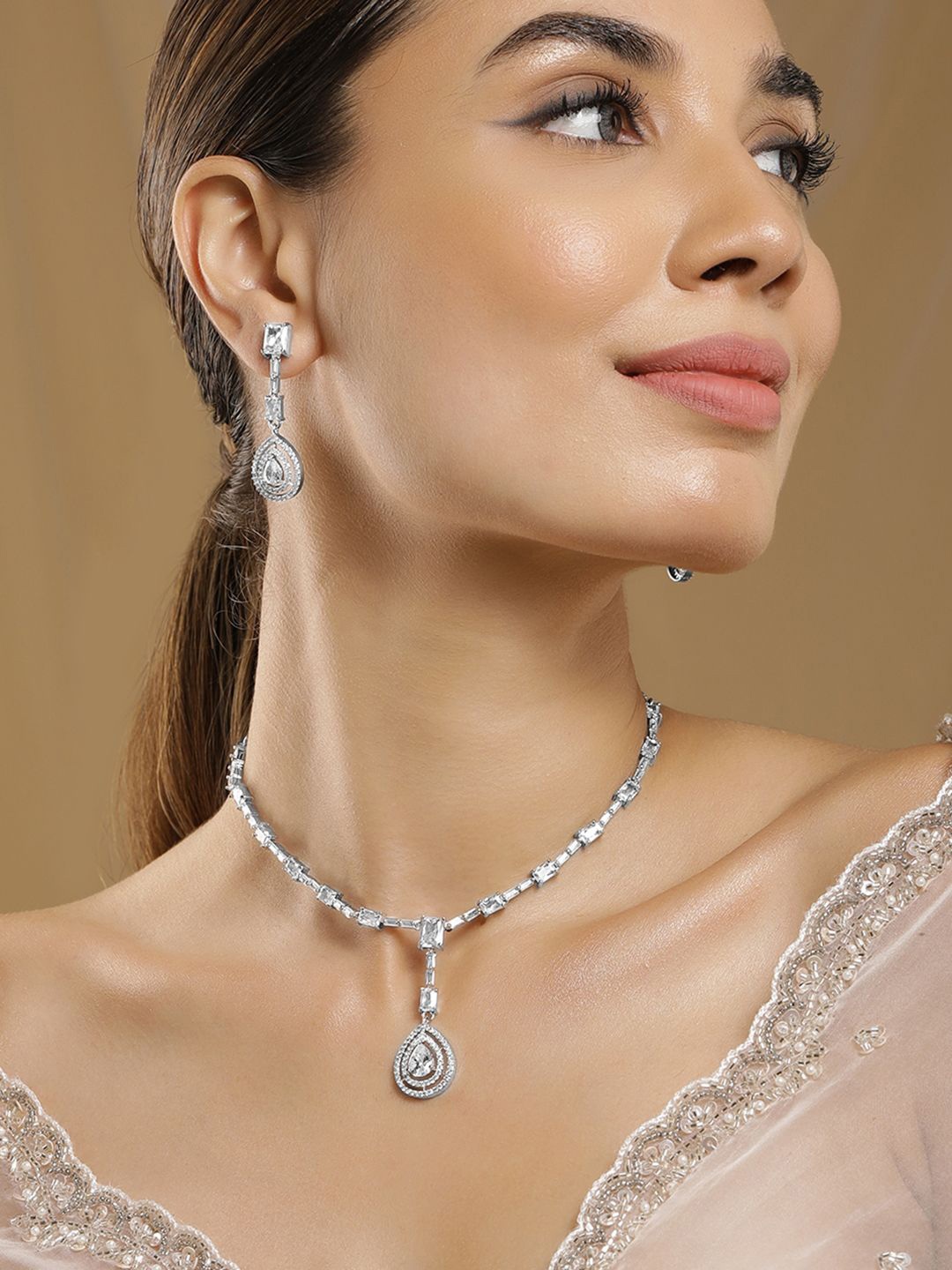 

Rubans Rhodium Plated AD & Cubic Zirconia Studded Necklace Set with Teardrop Pendants, Silver