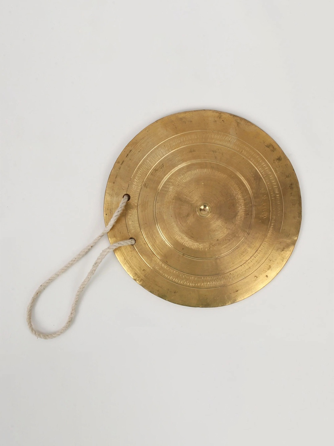 

Exotic India Gold Toned Bronze Textured Pooja Gong