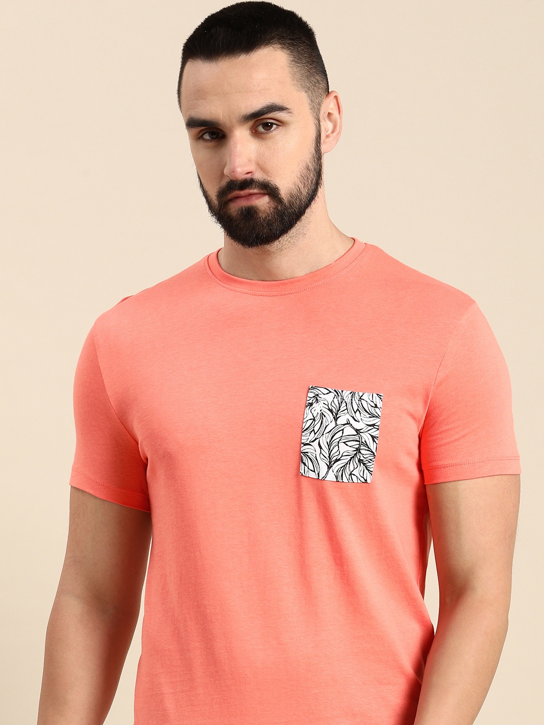 

Being Human Solid Round Neck Pure Cotton T-shirt With Printed Chest Pocket, Coral