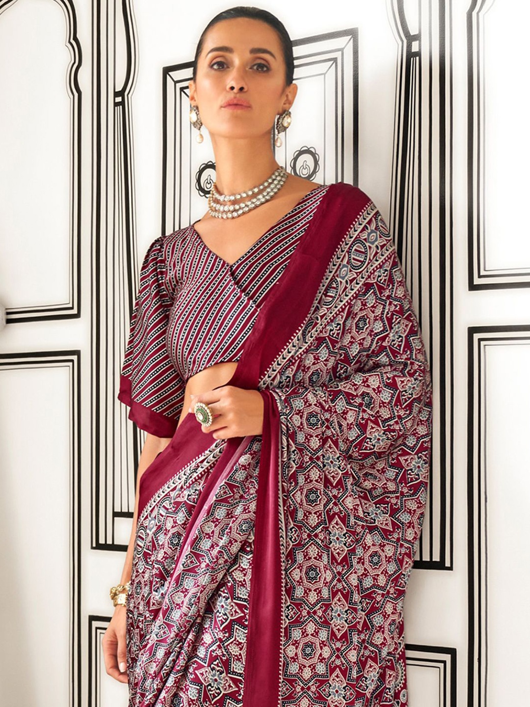 

Sangria Women Ethnic Motif Printed Sarees, Maroon