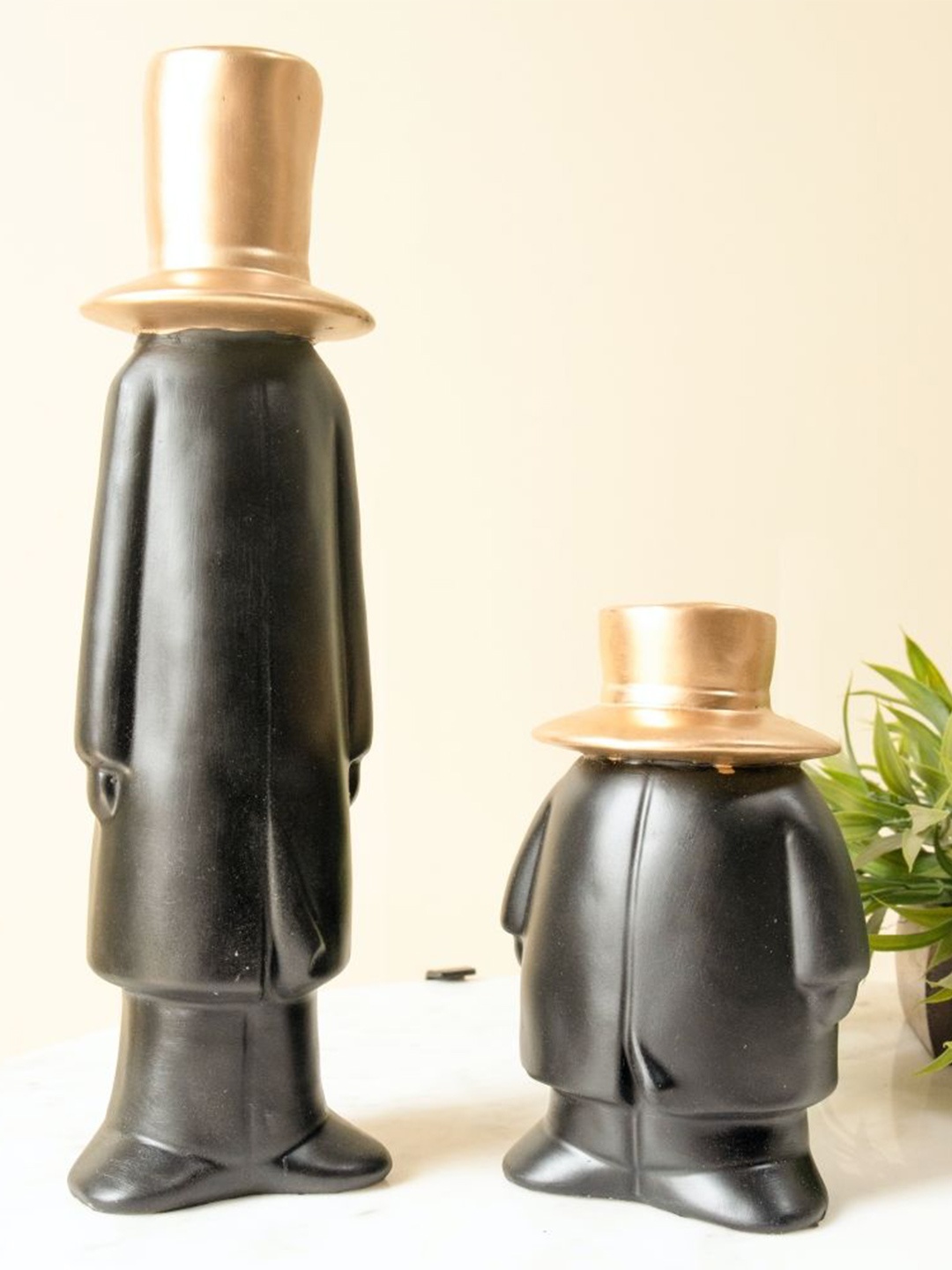 

ArteCasa Black & Gold Toned Figurine Showpiece