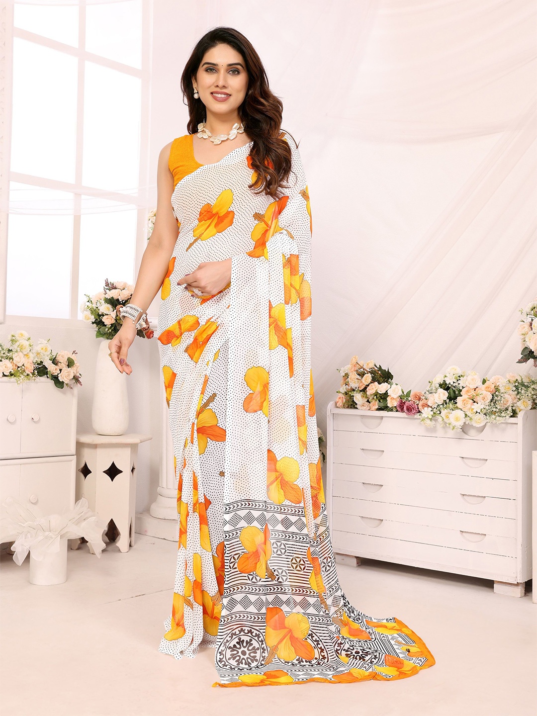 

Ambuja International Floral Pure Georgette Saree, Yellow