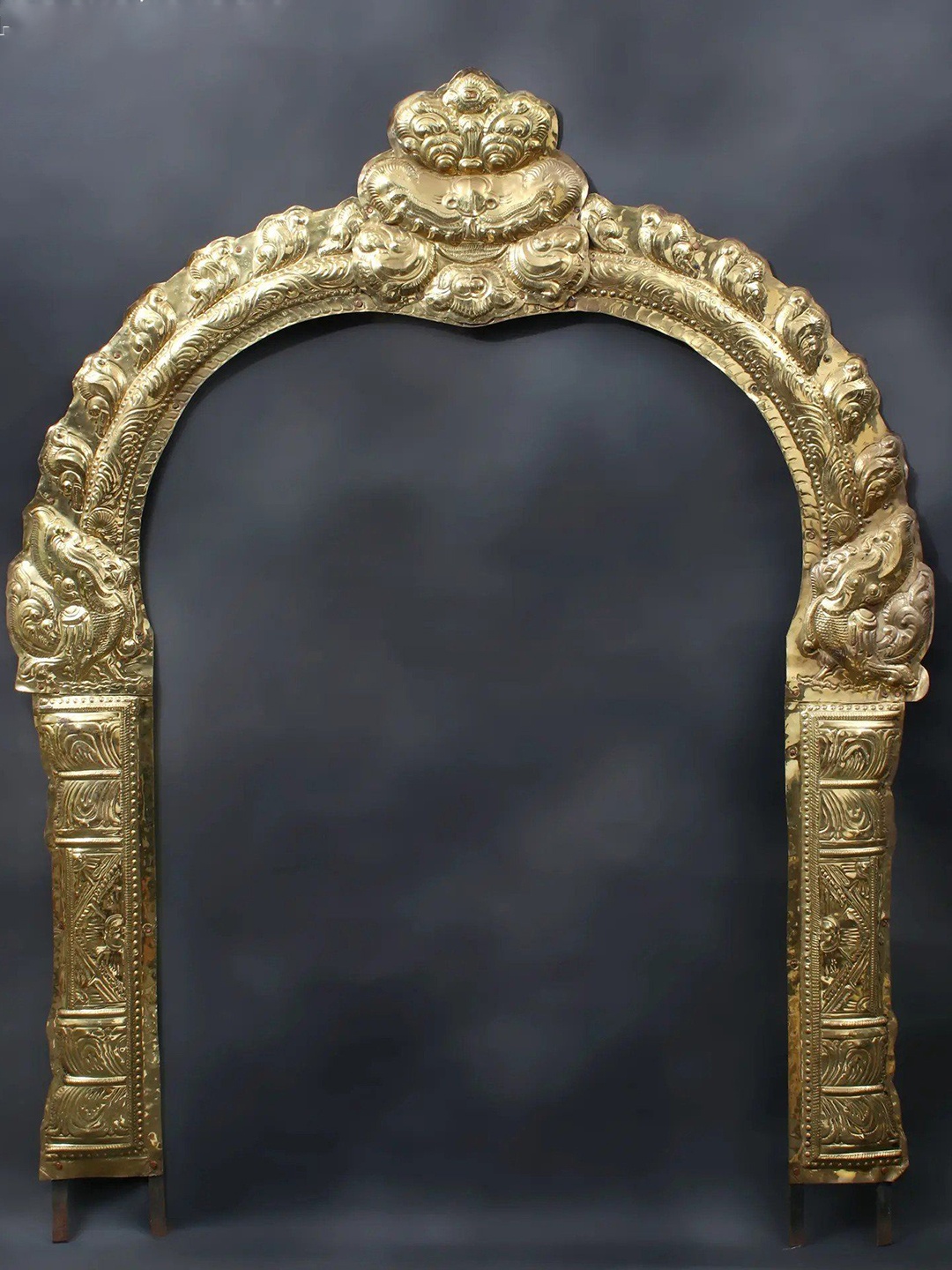 

Exotic India Gold Toned Thiruvachi Arch Brass Temple Prabhavali