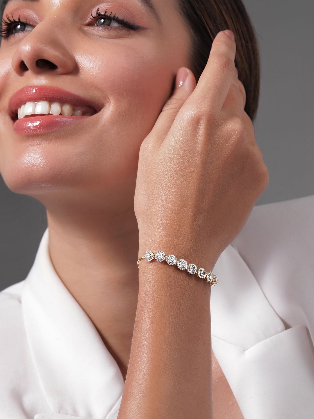 

Rubans 18K Gold Plated Cubic Zirconia Studded Bracelet with Round Charm Accents