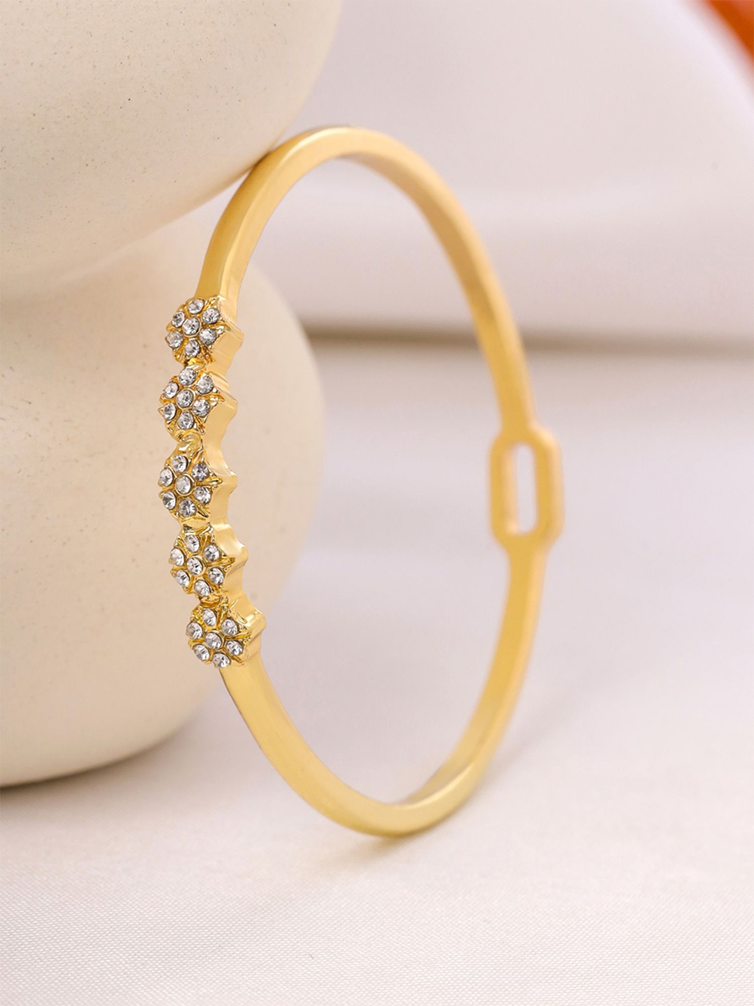 

Yellow Chimes Gold Plated Crystals Bangle Style Bracelet