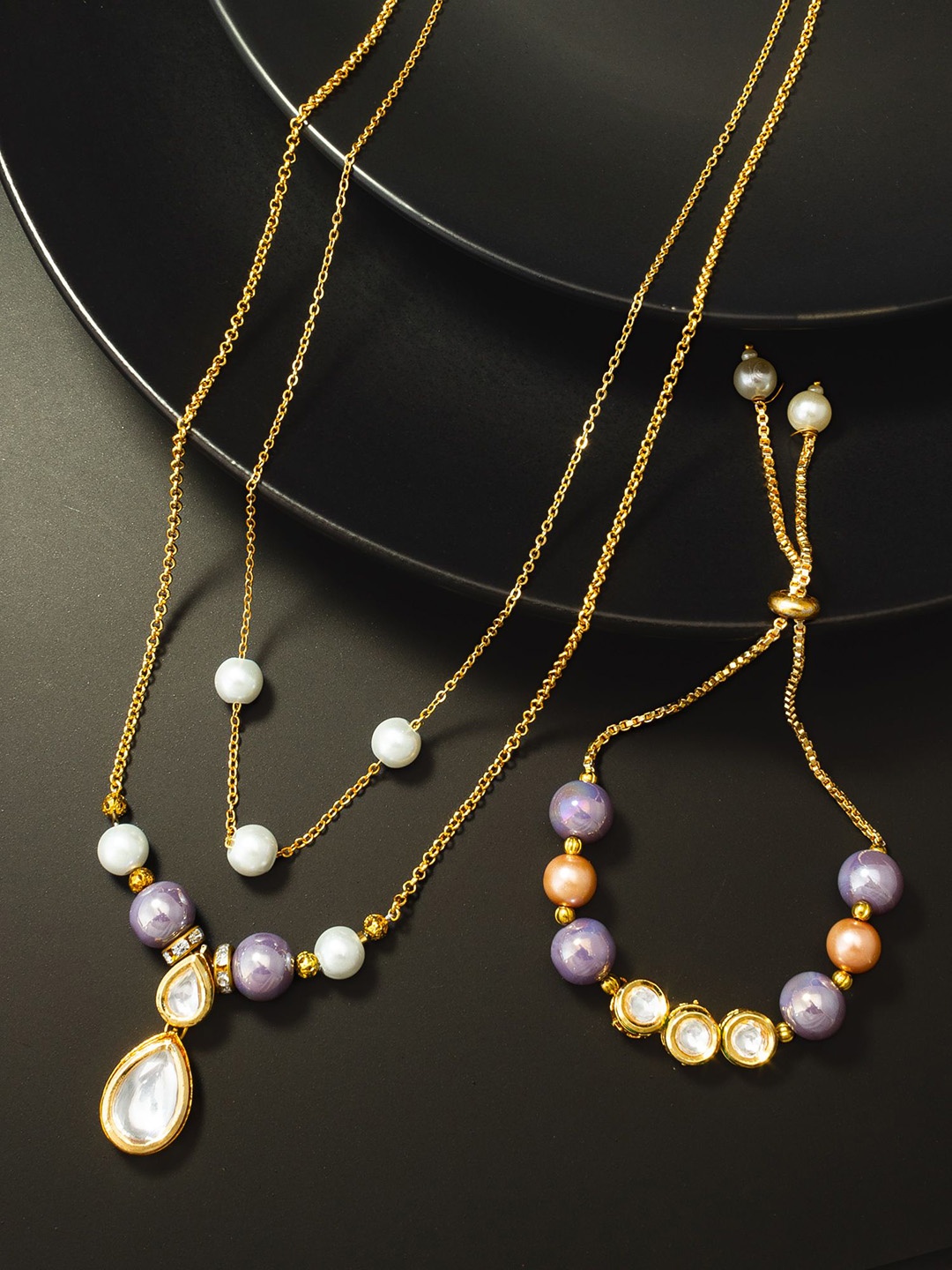 

aadita Gold-Plated Kundan-Studded & Pearl Beaded Jewellery Set