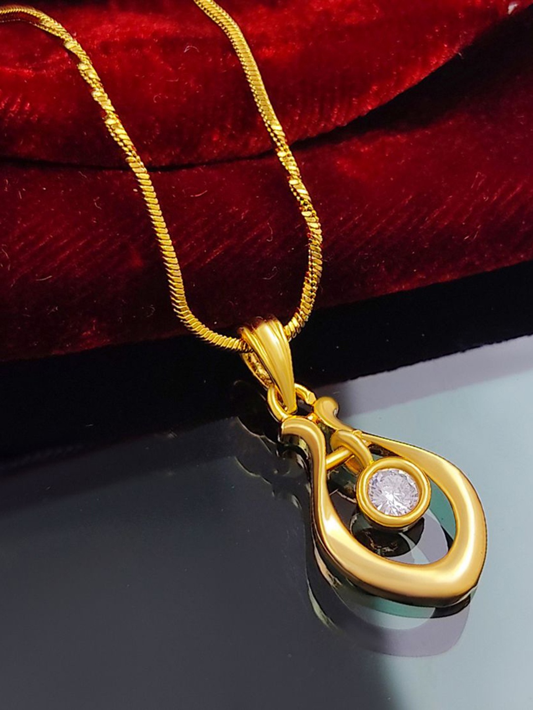 

Saizen Gold-Plated Stone Studded Oval Pendant With Chain