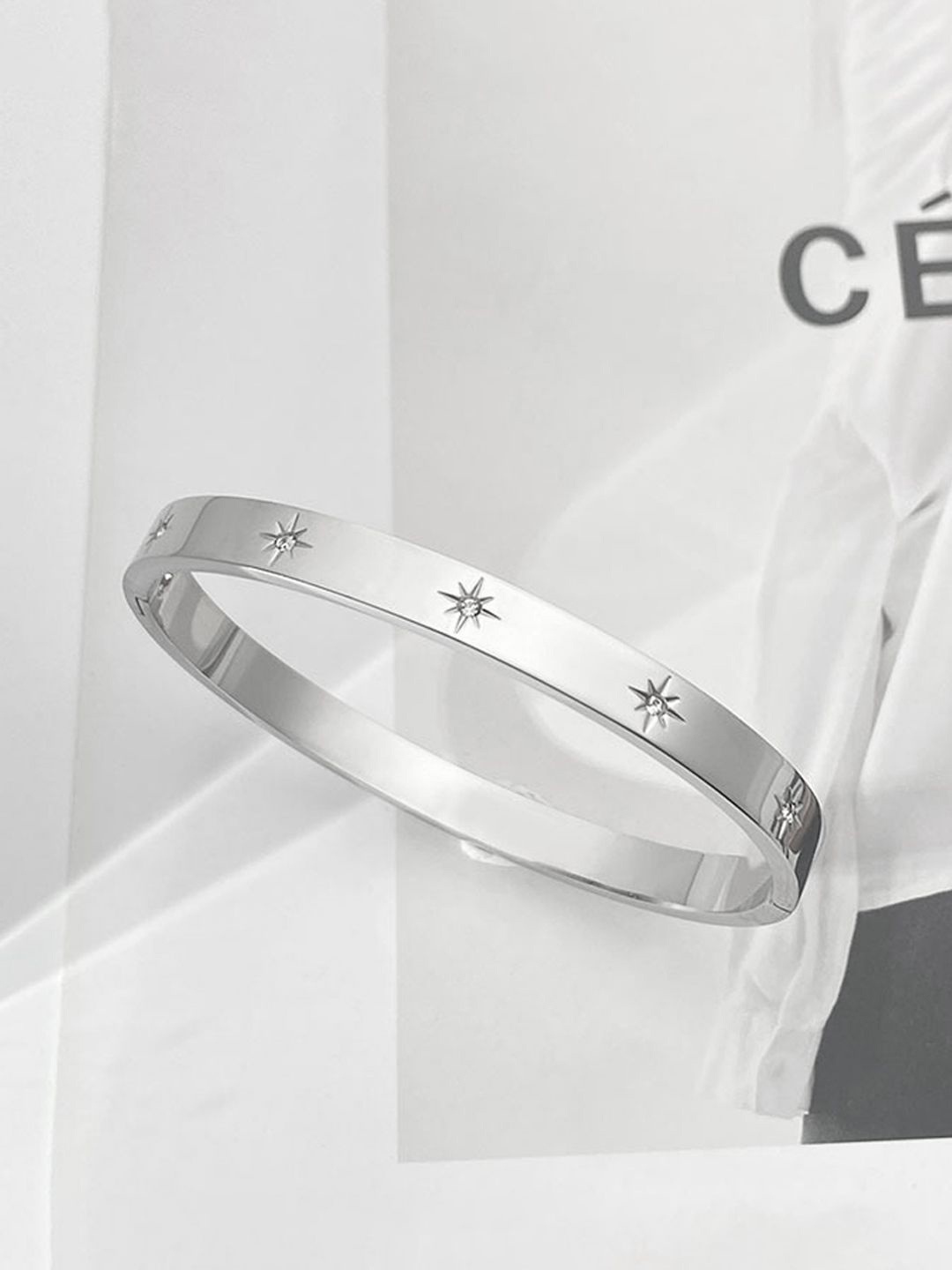 

Jewels Galaxy Silver-Plated Stainless Steel American Diamond Studded Bangle-Style Bracelet