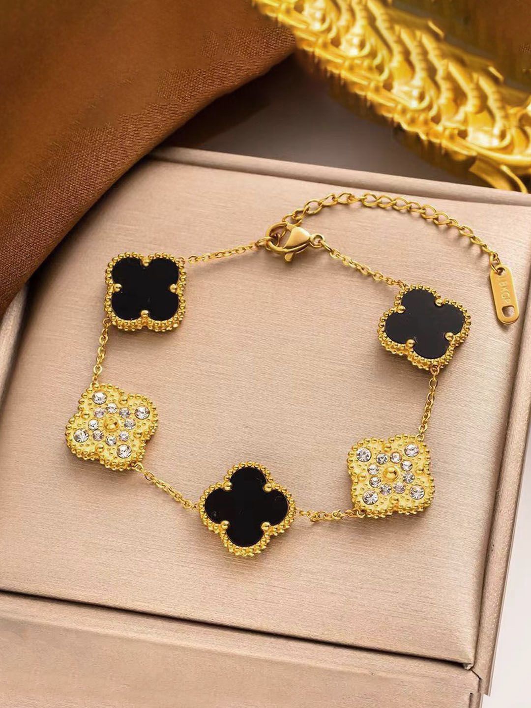 

Jewels Galaxy Gold-Plated Stainless Steel American Diamond Studded Link bracelet